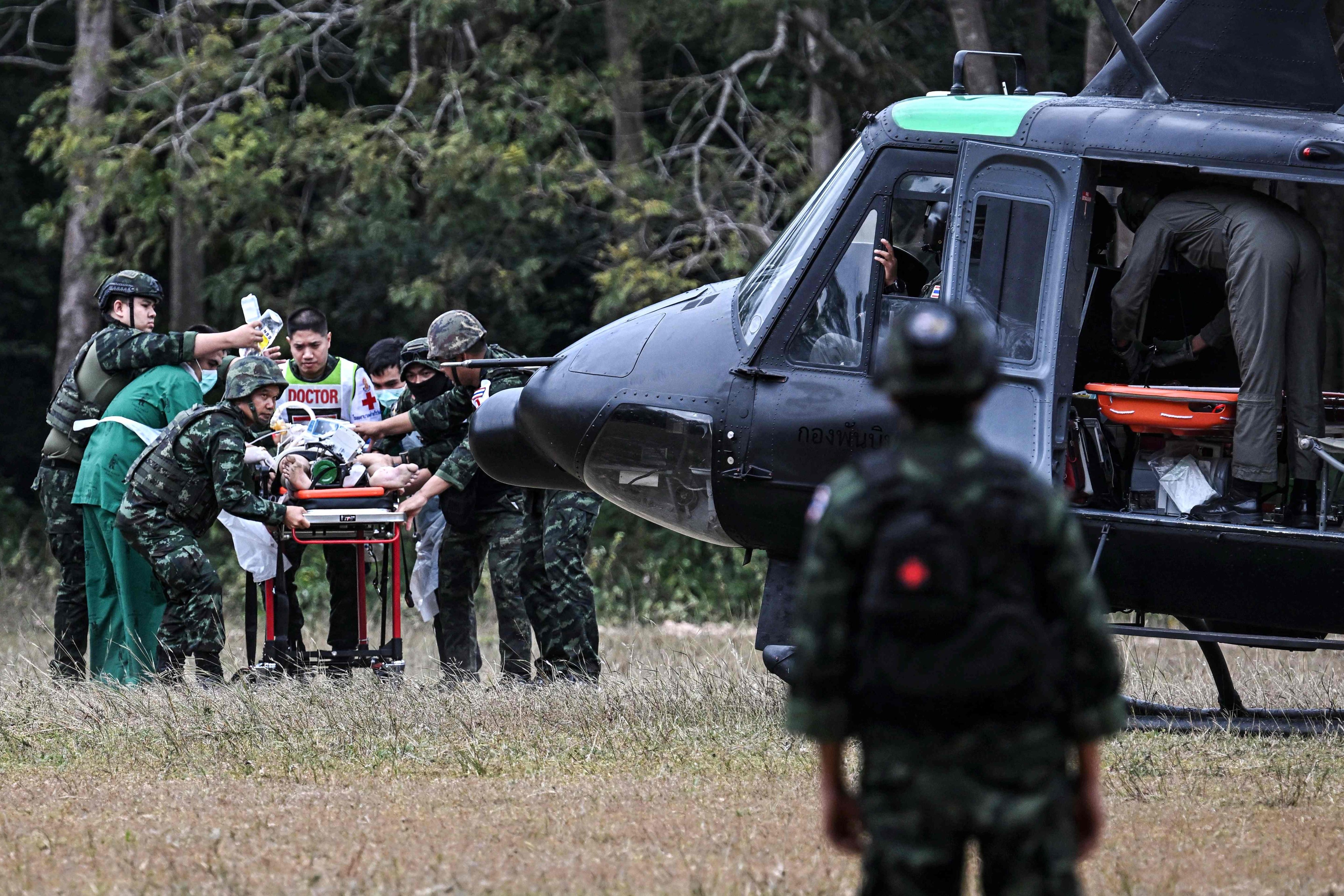 An injured person taken to a military helicopter during clashes along the Thai-Cambodian border in Thailand’s Surin province on Wednesday. Photo: AFP