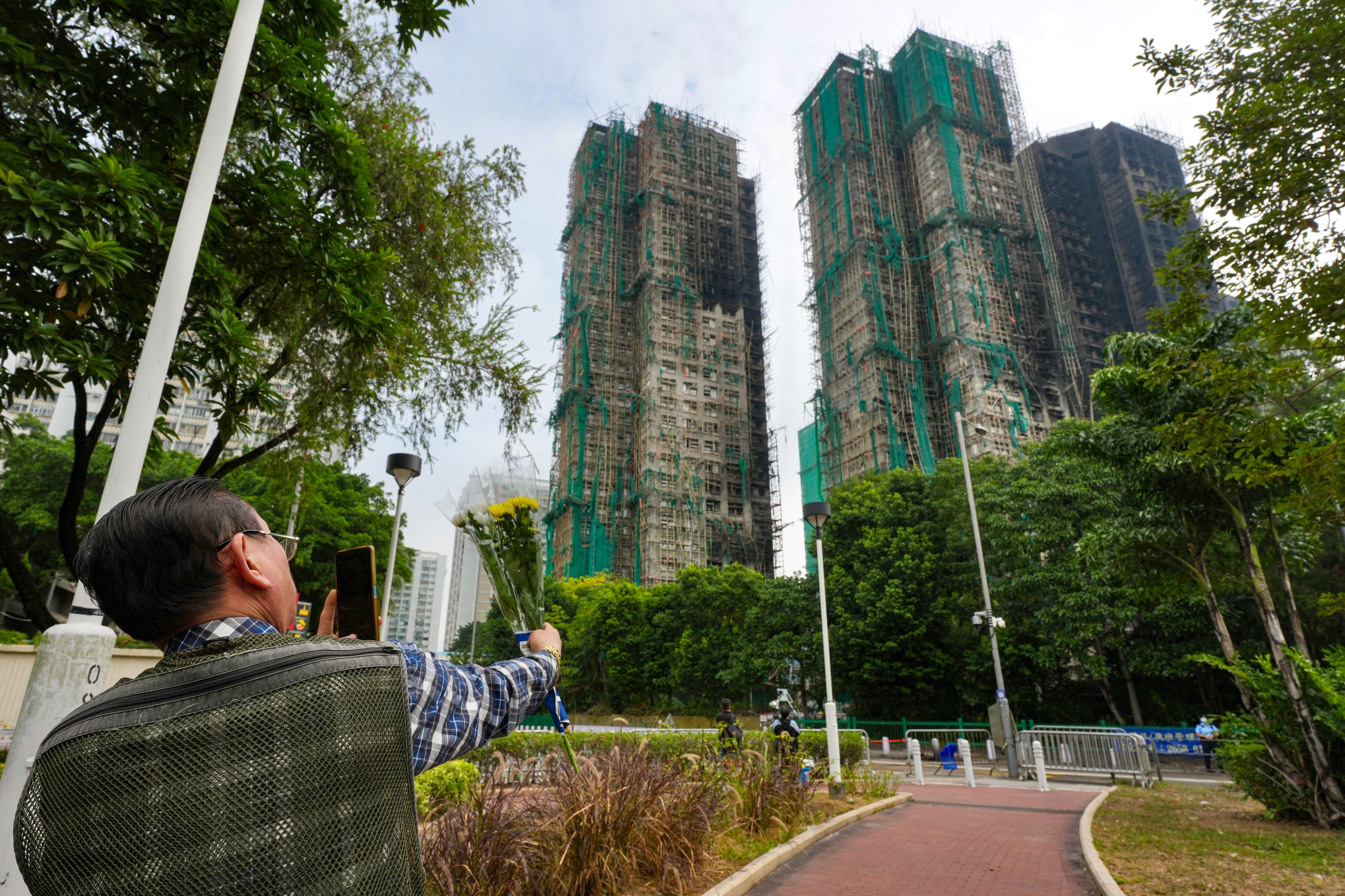 A man has been arrested for posing as victim of the deadly fire in Tai Po to claim relief aid. Photo: Karma Lo