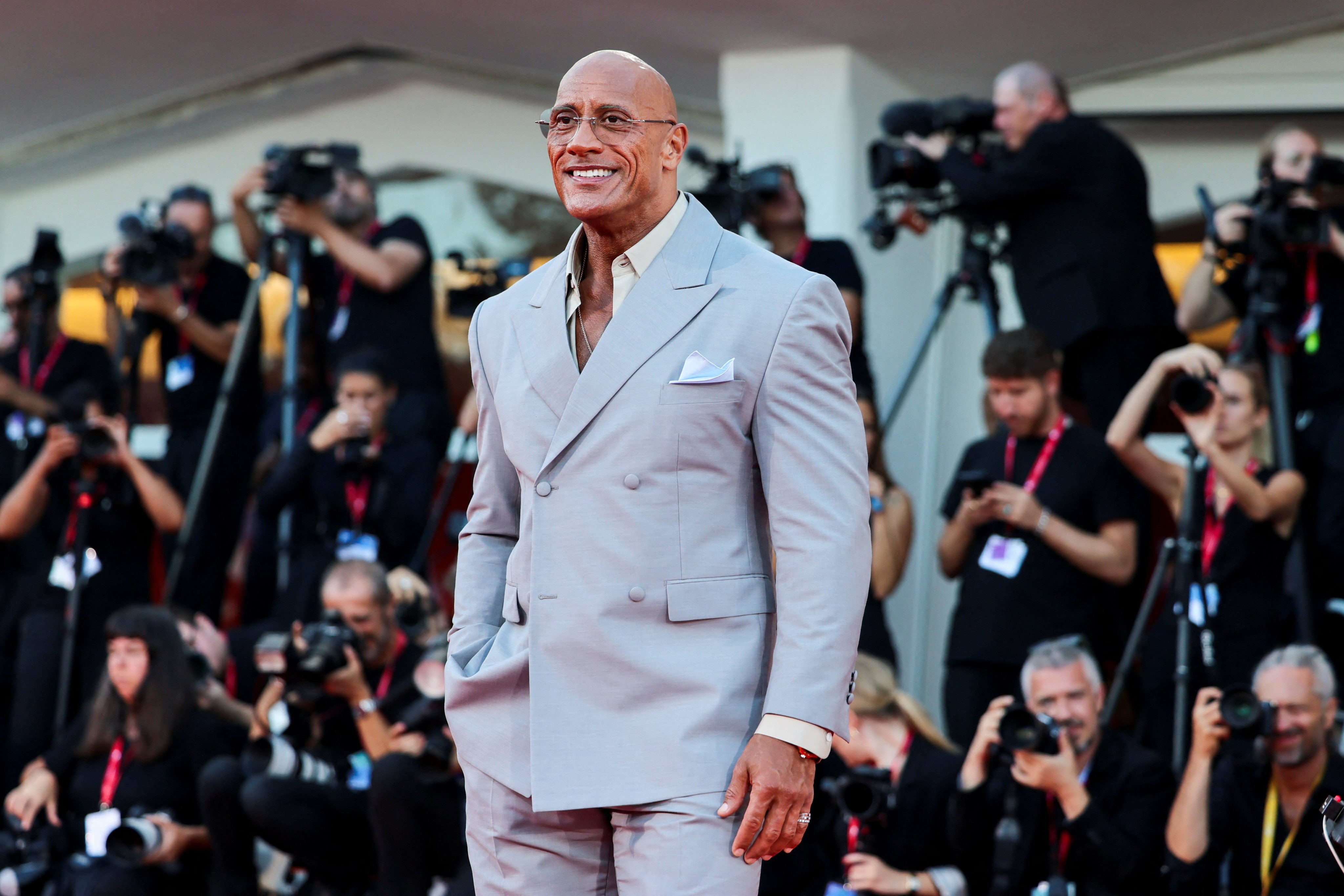 Dwayne “The Rock” Johnson traded in his usual muscle-hugging tailoring for something more refined at this year’s Venice Film Festival. Photo: Reuters