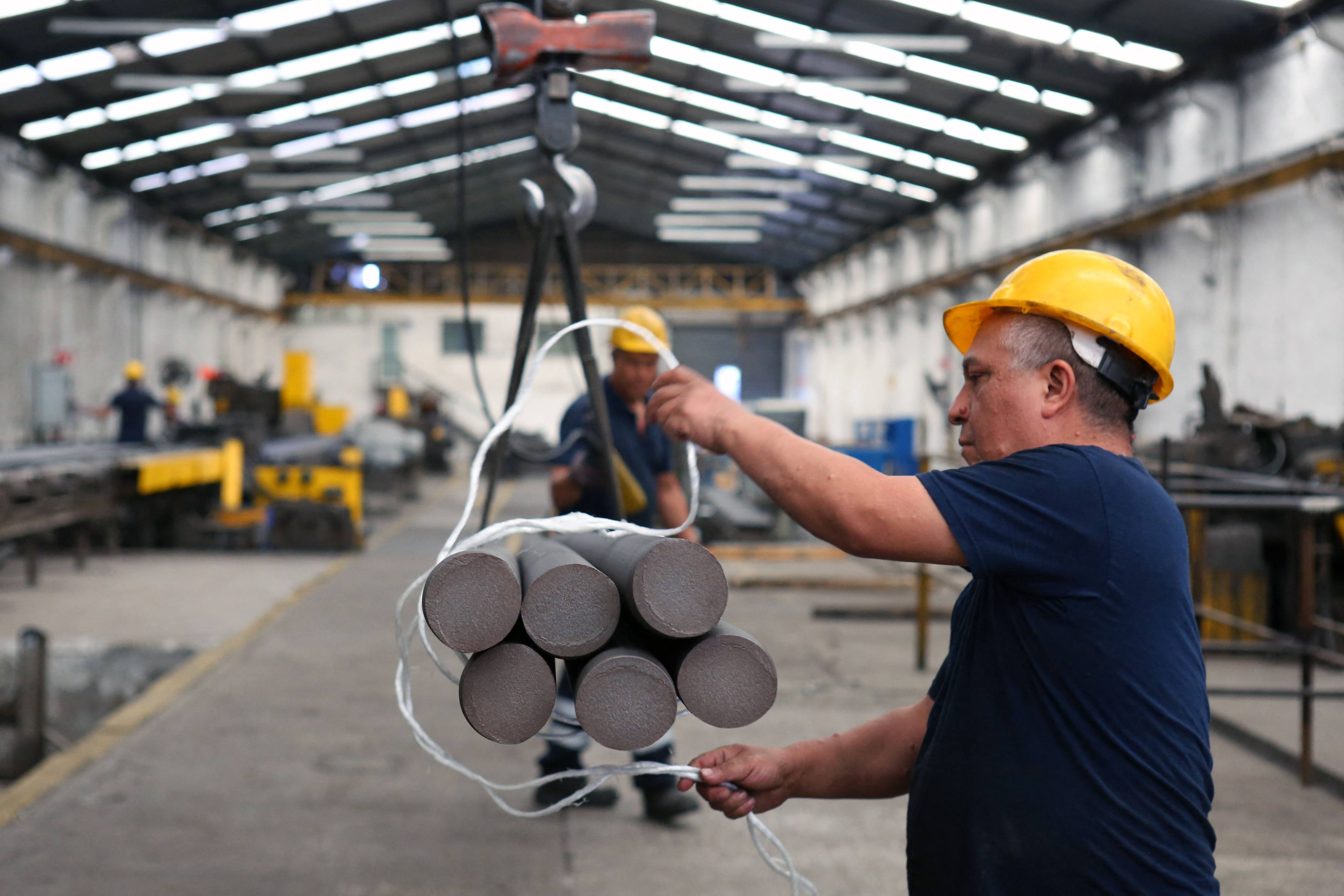Employees work at a steel bar factory in Santa Catarina, Nuevo Leon state, Mexico, in November. Photo: AFP