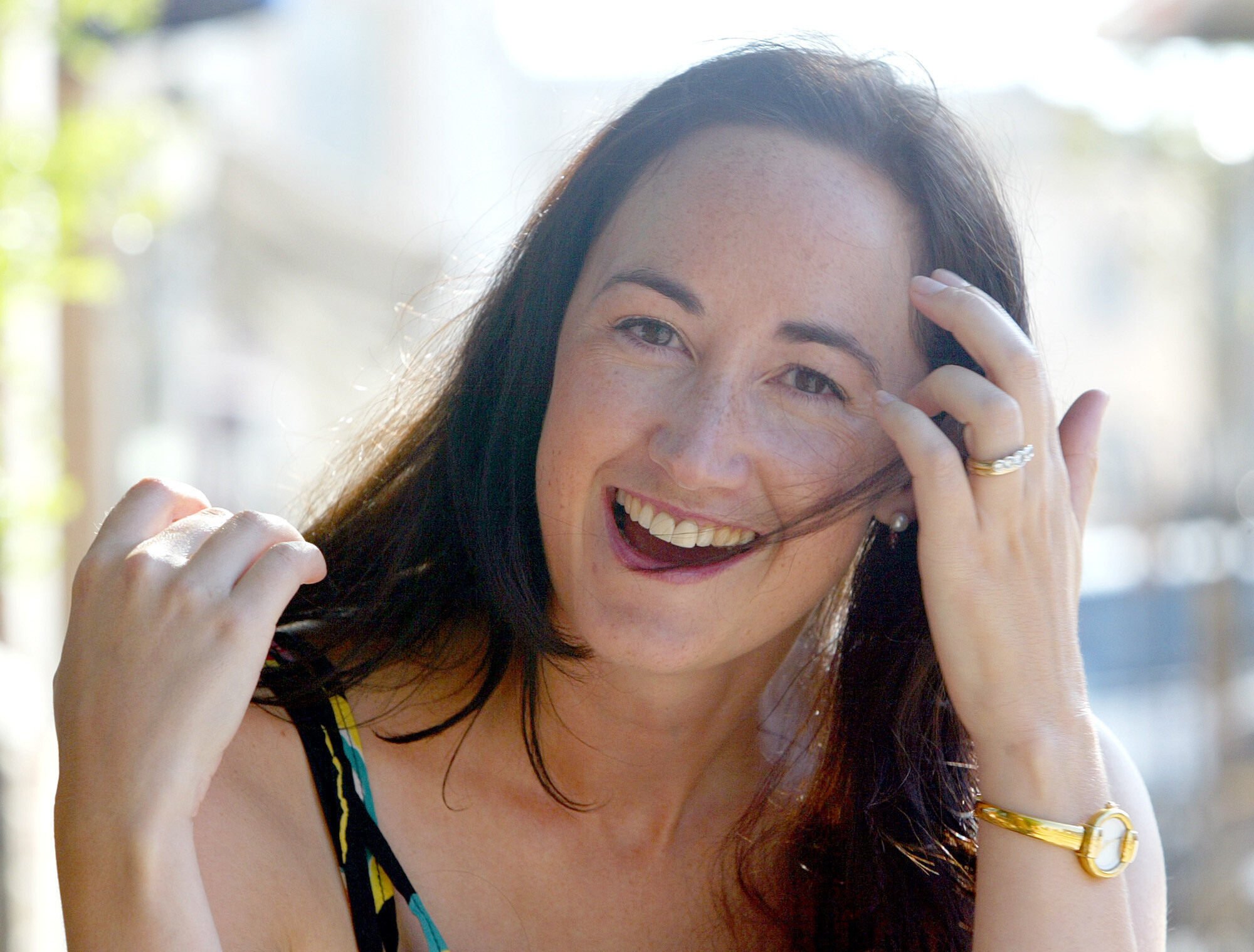 Author Sophie Kinsella poses on Wimbledon Village high street, London in 2004. Photo: AP
