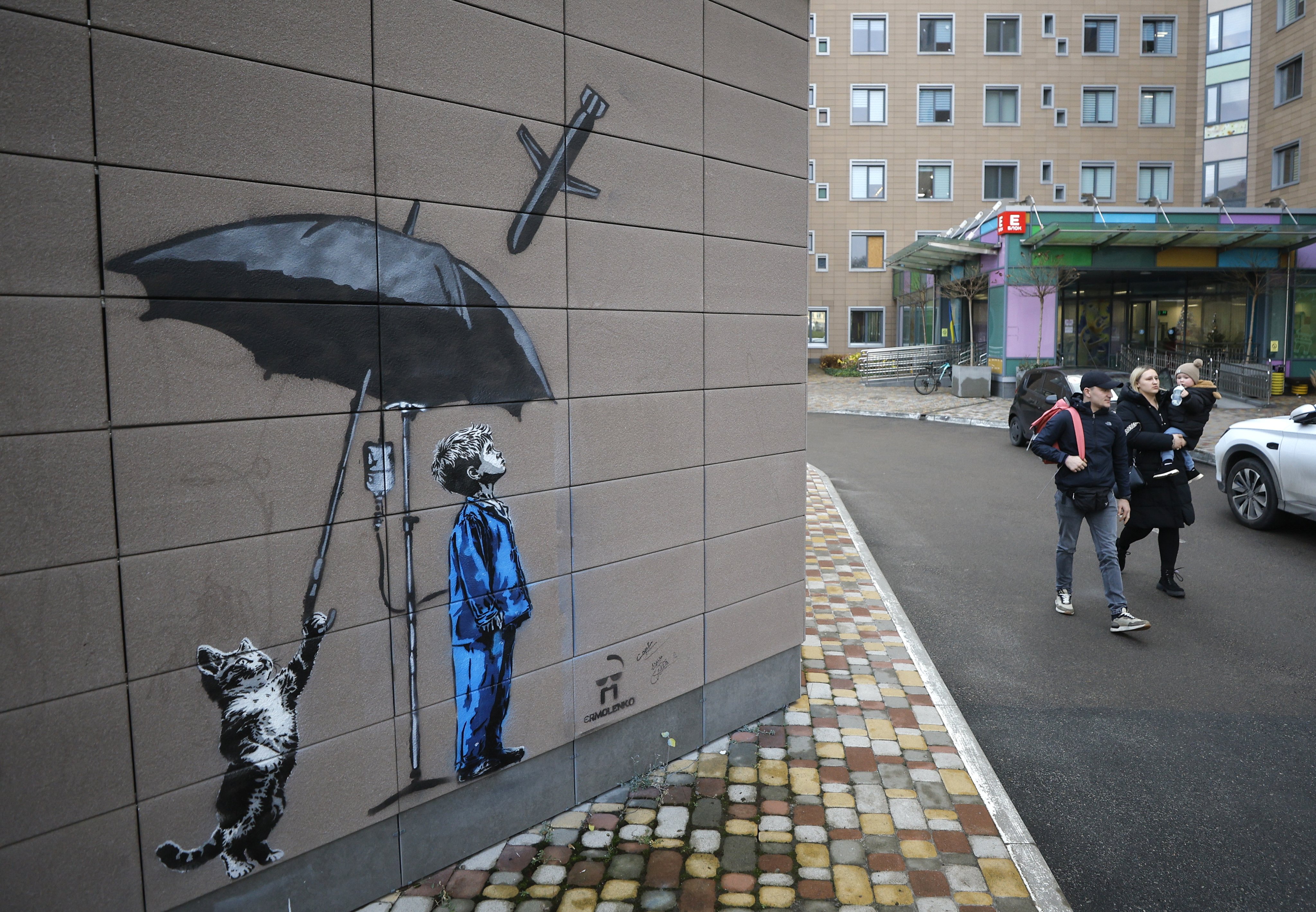 A cat protects a boy from a Russian missile with an umbrella, in a mural by Ukrainian artist Andriy Yarmolenko, seen by on Wednesday at a children’s hospital in Kyiv. Photo: EPA