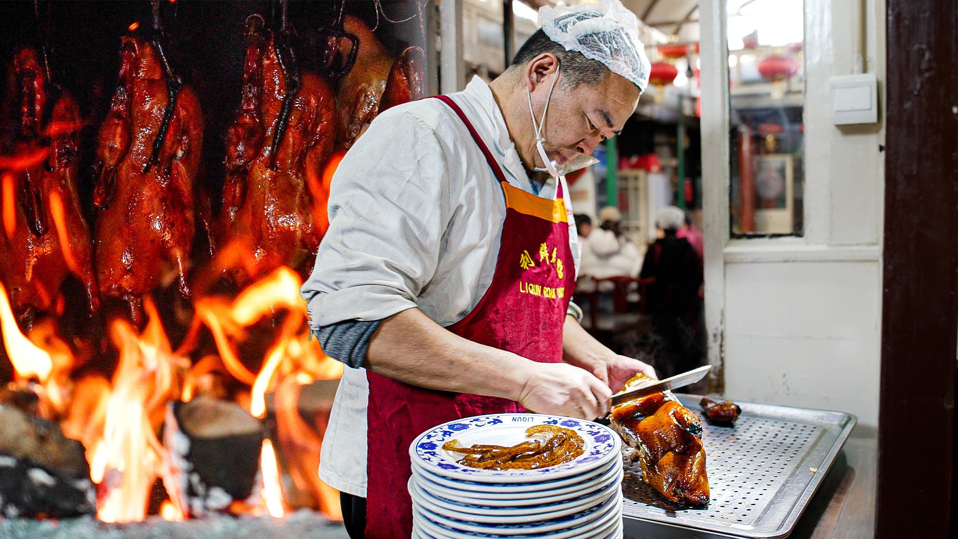 A server carves a Peking duck at Liqun Restaurant in Beijing