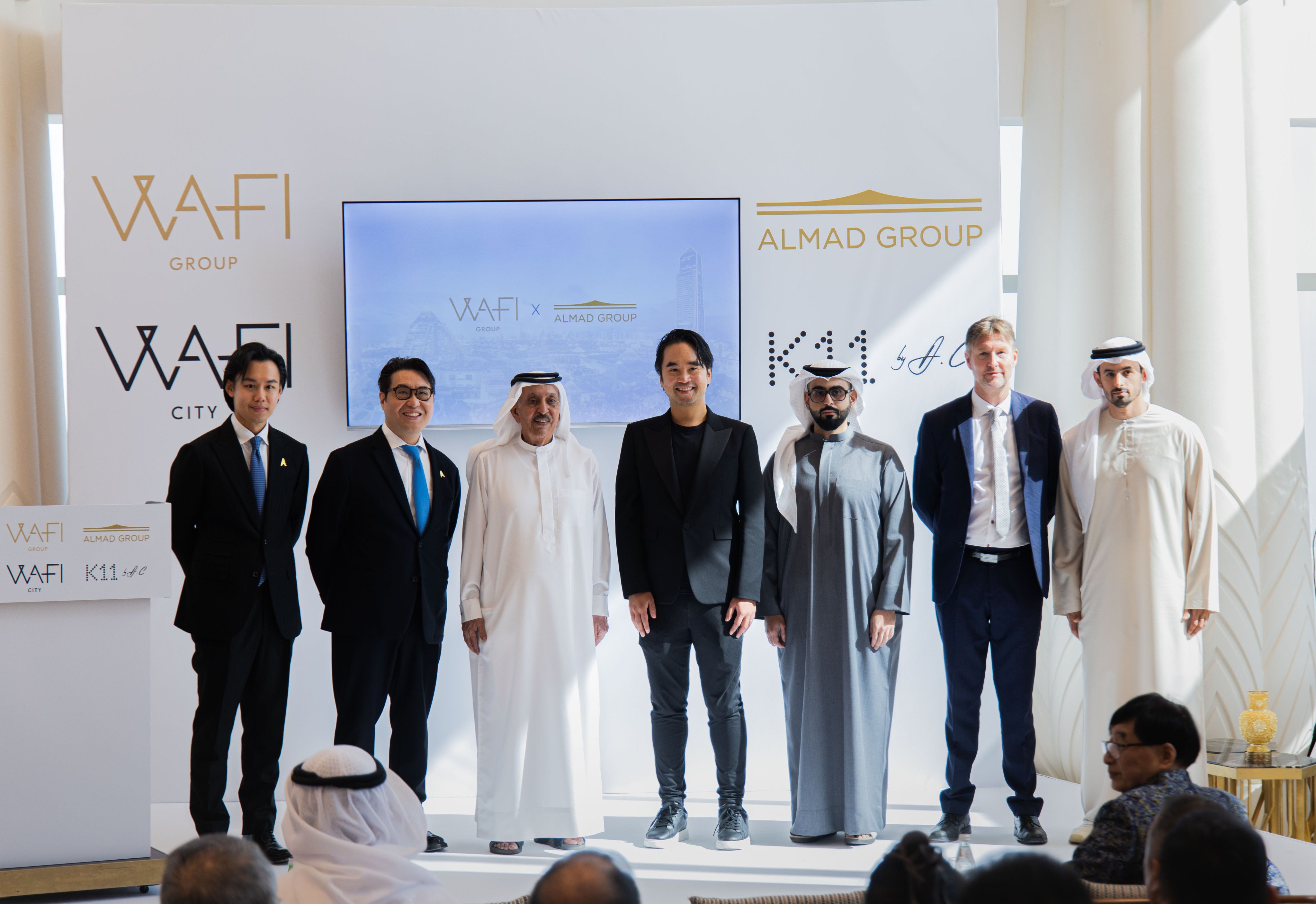 Sheikh Mana bin Khalifa Al Maktoum (third from left) and Adrian Cheng (centre), pictured at a signing ceremony on Wednesday in Dubai. Photo: Handout
