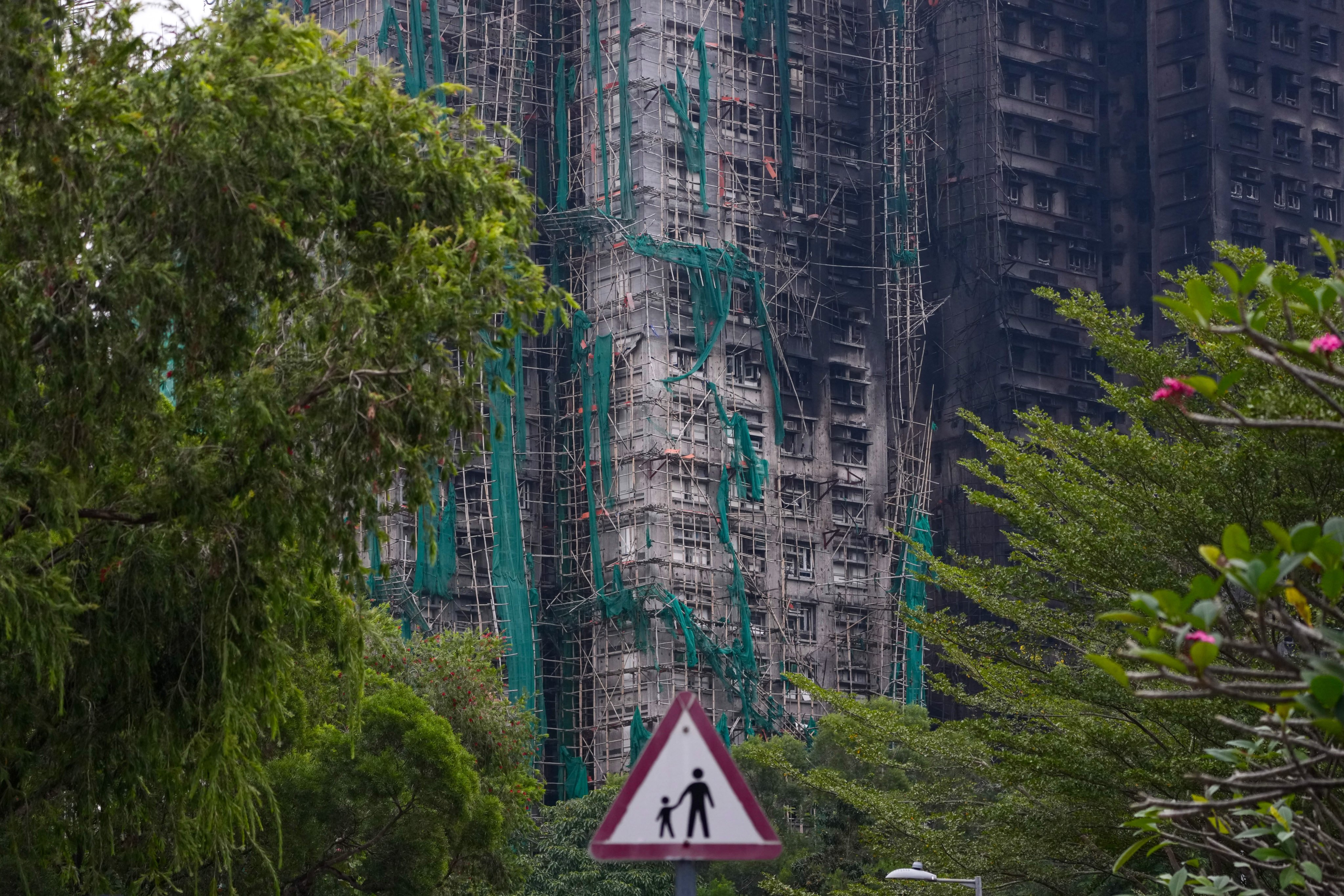 The November 26 fire that broke out at Wang Fuk Court in Tai Po quickly spread along the mesh on bamboo scaffolding across multiple residential blocks. Photo: Karma Lo