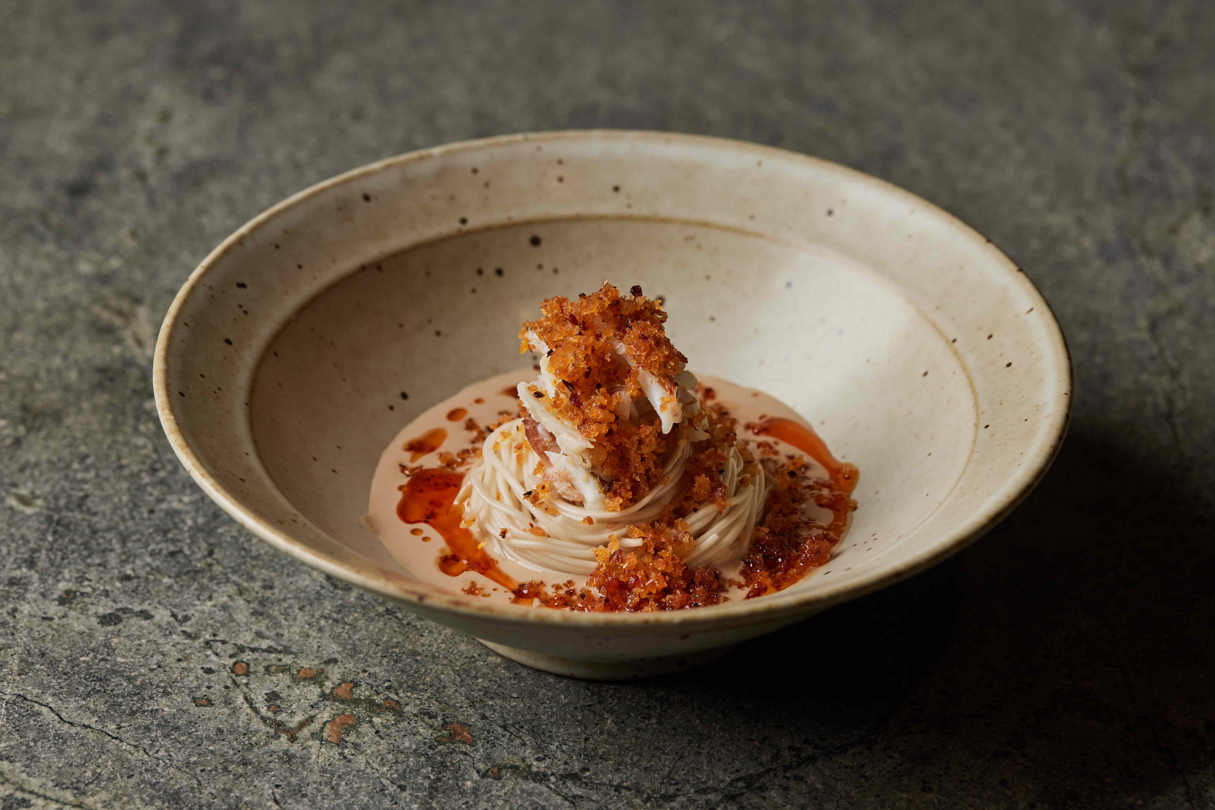 Path’s signature flower crab dan dan noodles, in Hong Kong. Photo: Handout