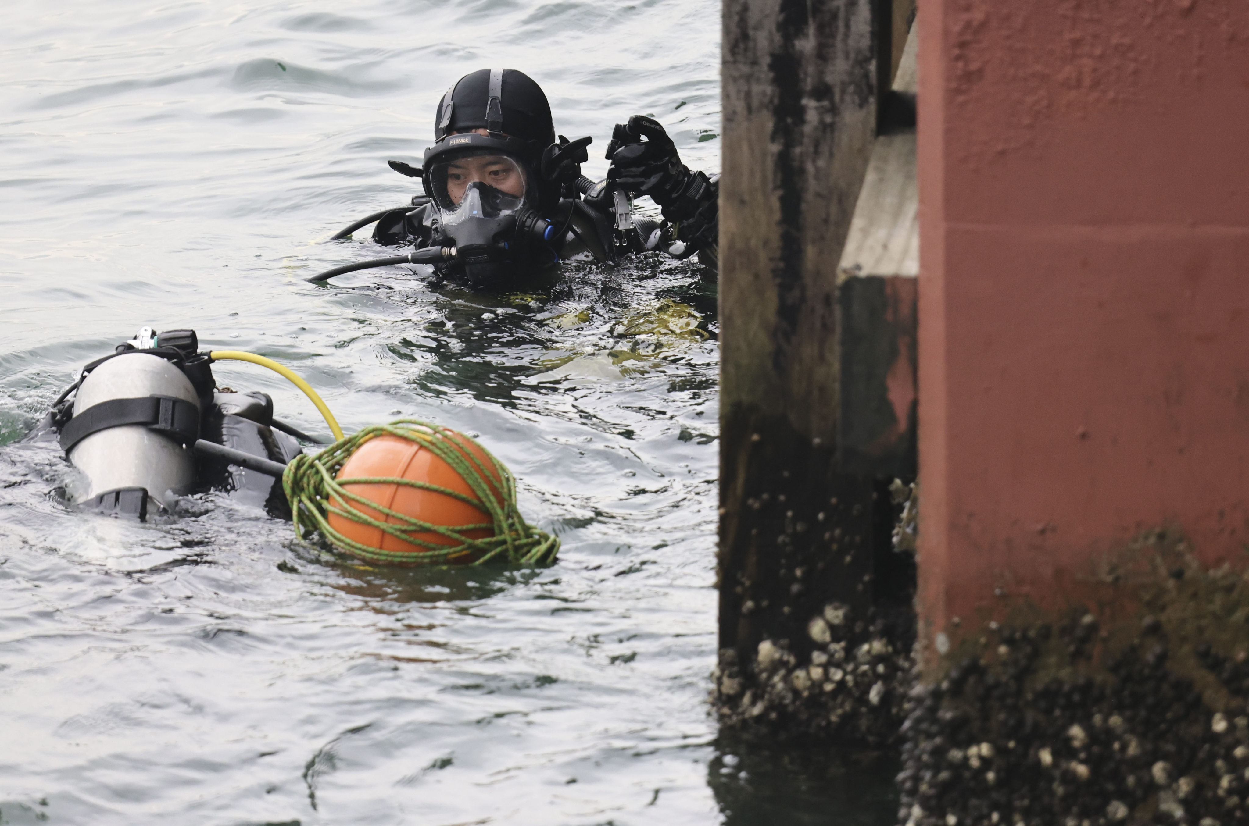 The Special Duties Unit is an elite squad of the Hong Kong Police Force and carries out high-risk operations. This diver is pictured during a police operation in June. Photo: Jelly Tse
