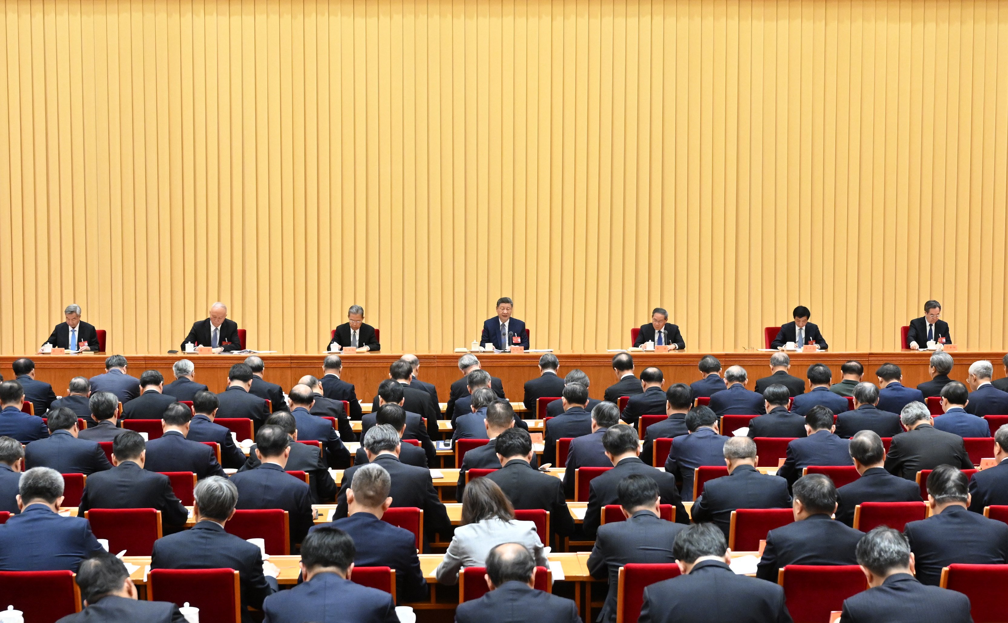 President Xi Jinping (centre) speaks at the annual central economic work conference in Beijing on Thursday. Photo: Xinhua