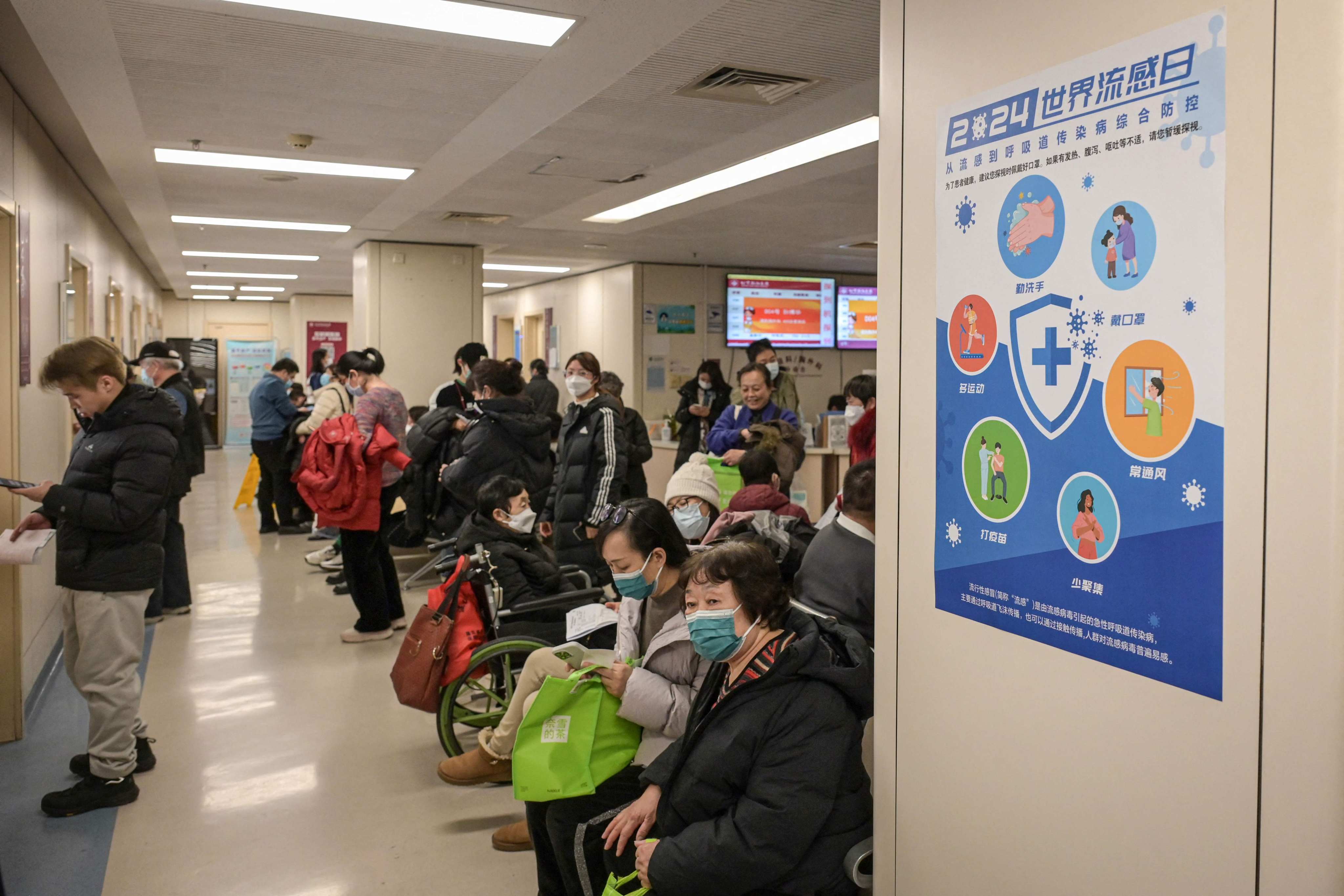 People queue up in the outpatient area of a Beijing hospital’s respiratory disease department in January. Photo: AFP