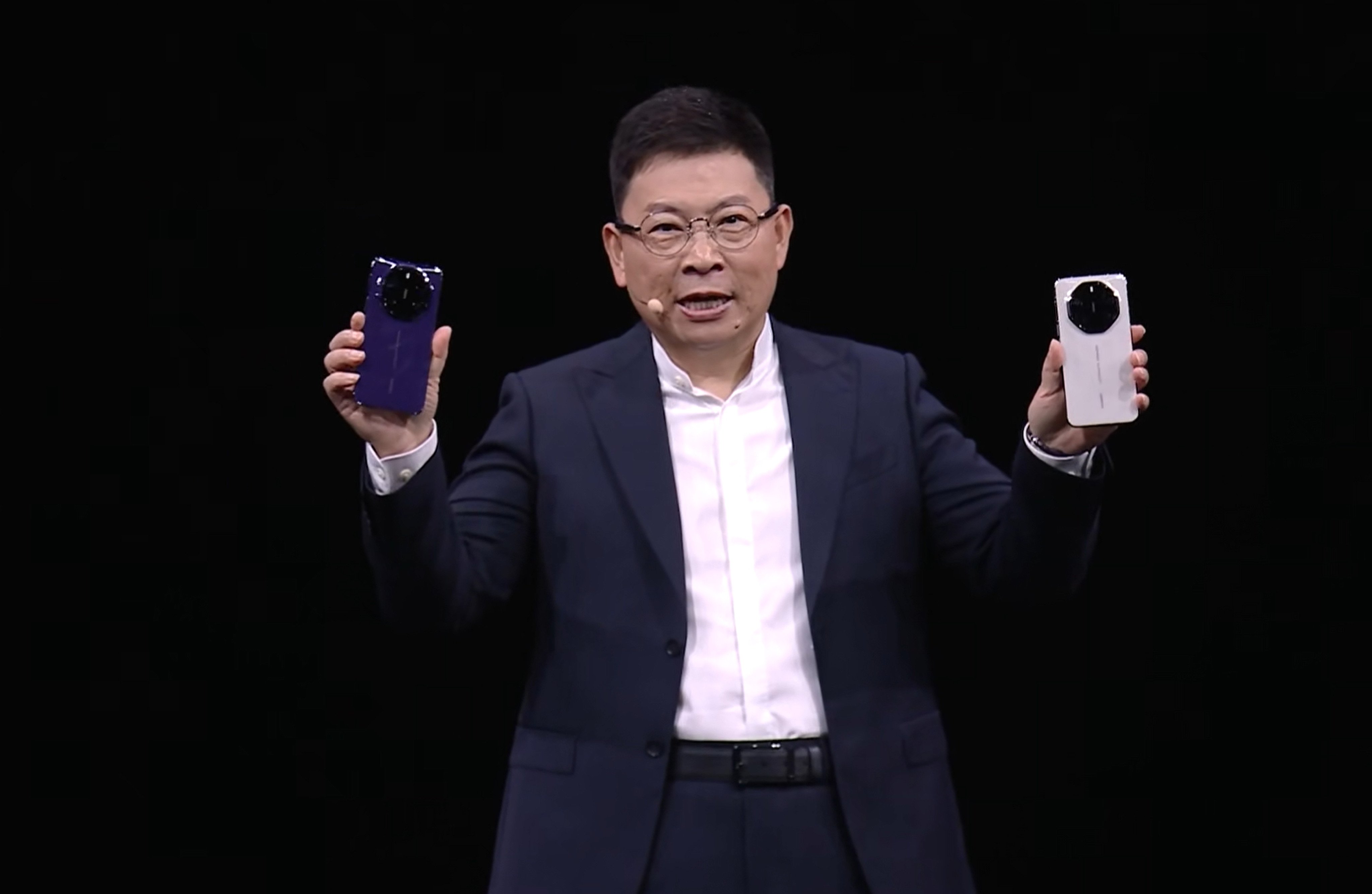 Richard Yu Chengdong, chairman of Huawei’s Consumer Business Group, showcases the company’s Mate 80 smartphones at a launch event on November 25, 2025. Photo: Handout