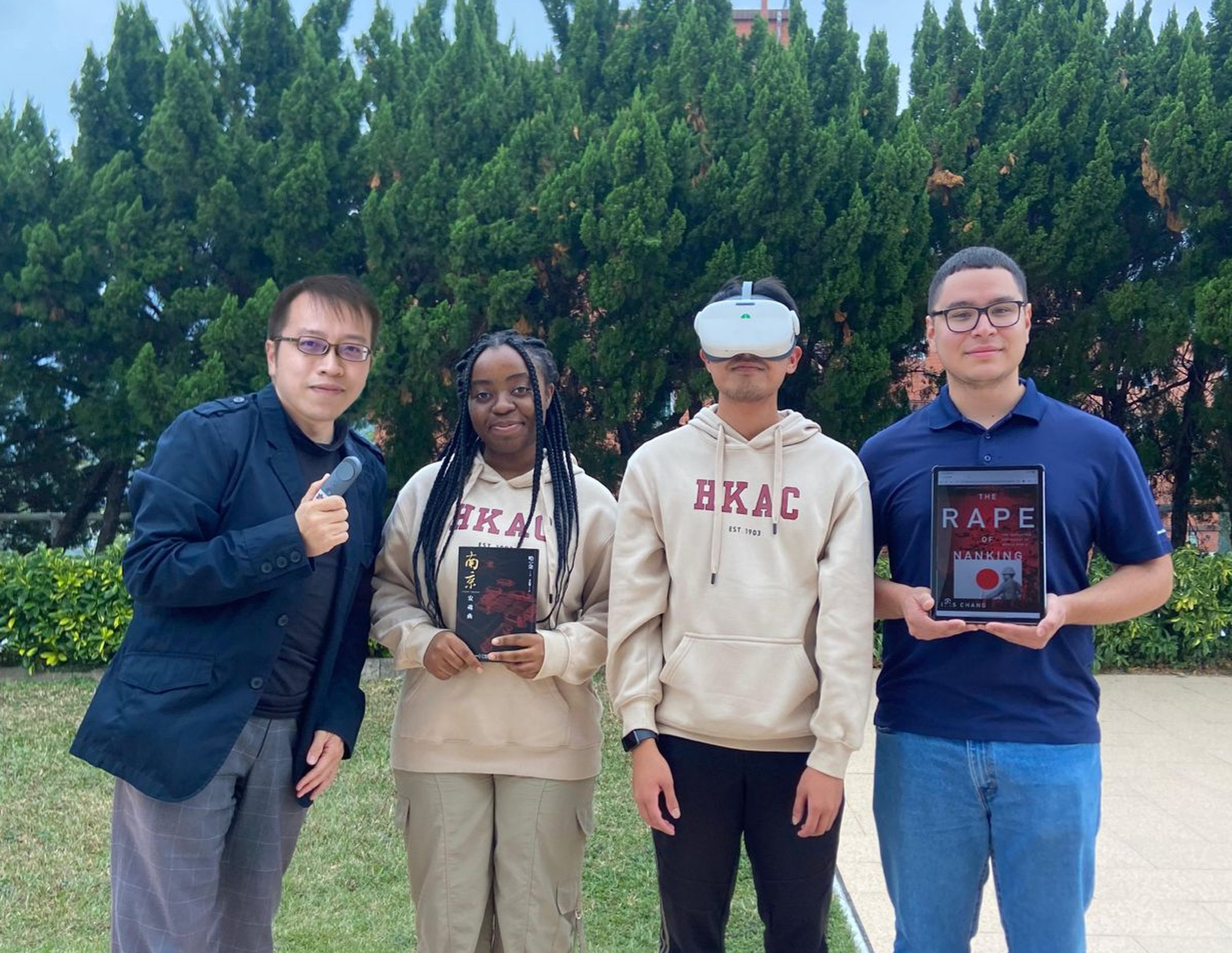 Simon Li, executive director of the Hong Kong Holocaust and Tolerance Centre, with students (from second left) Kavira S. Kazimoto, Gem Peduche and Josue Camarena, at Andrews University’s Hong Kong campus. Photo: Handout