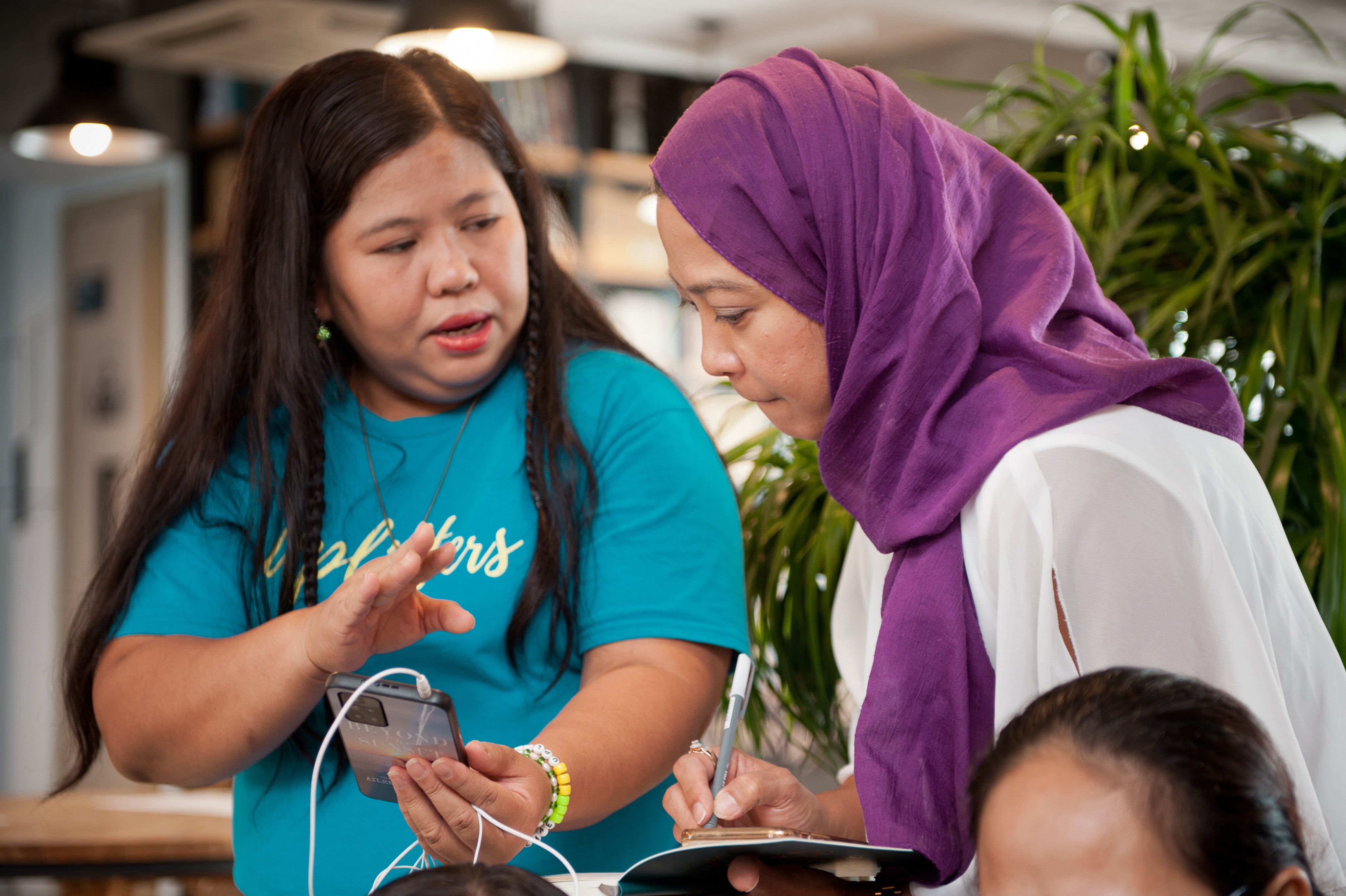 Filipino domestic worker Ailenemae Ramos (left) has been helping other migrant domestic workers with her newly gained knowledge and skills. Photo: Handout