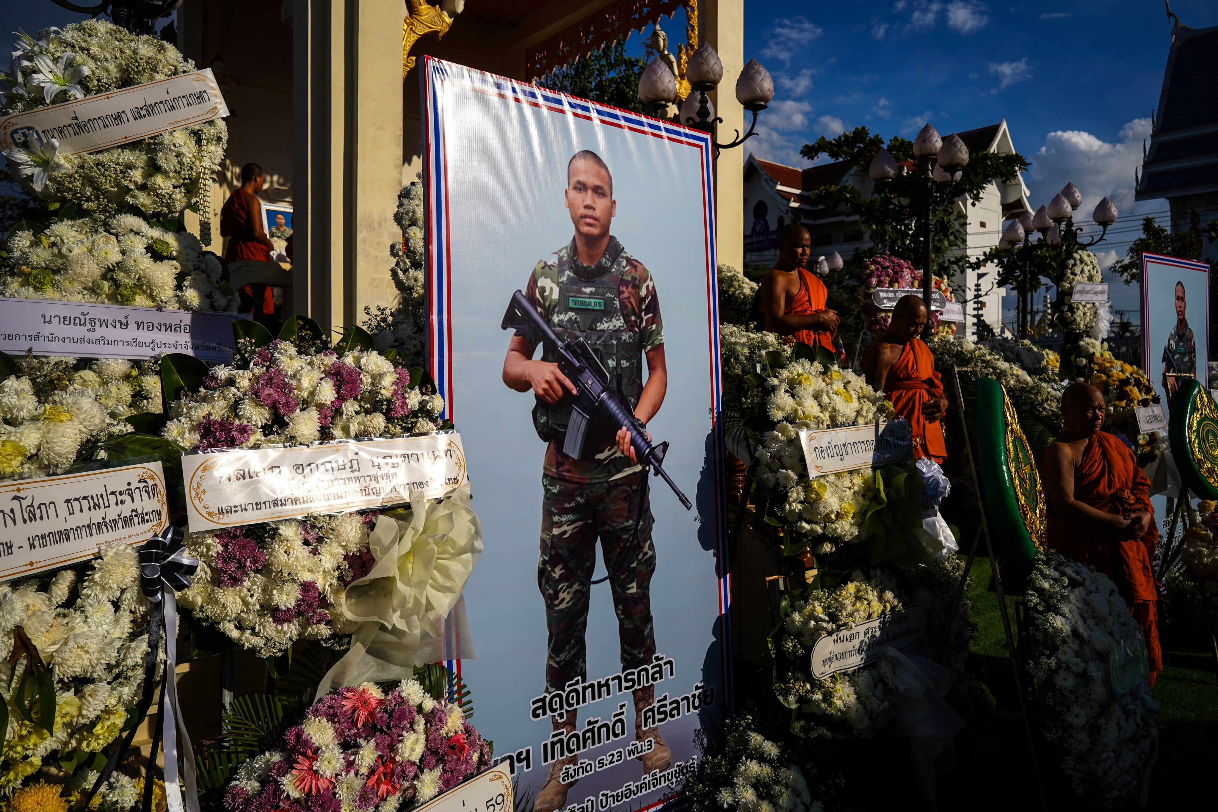 Buddhist monks attend a royal cremation of a soldier killed in the border fighting at a temple in Thailand’s Sisaket province on Saturday. Photo: Reuters