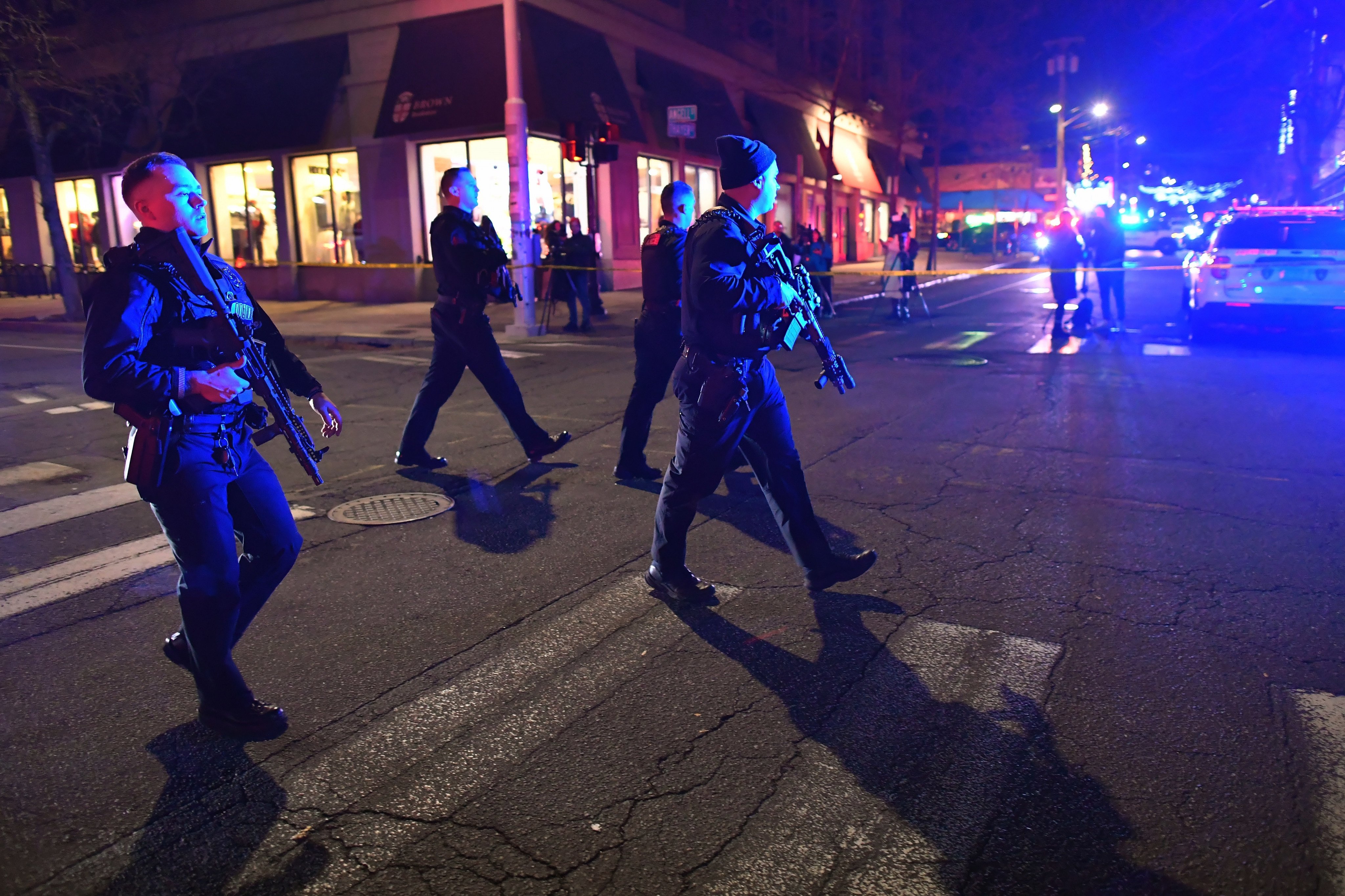 Law enforcement officials walk on a street in a neighbourhood near Brown University. Photo: AP