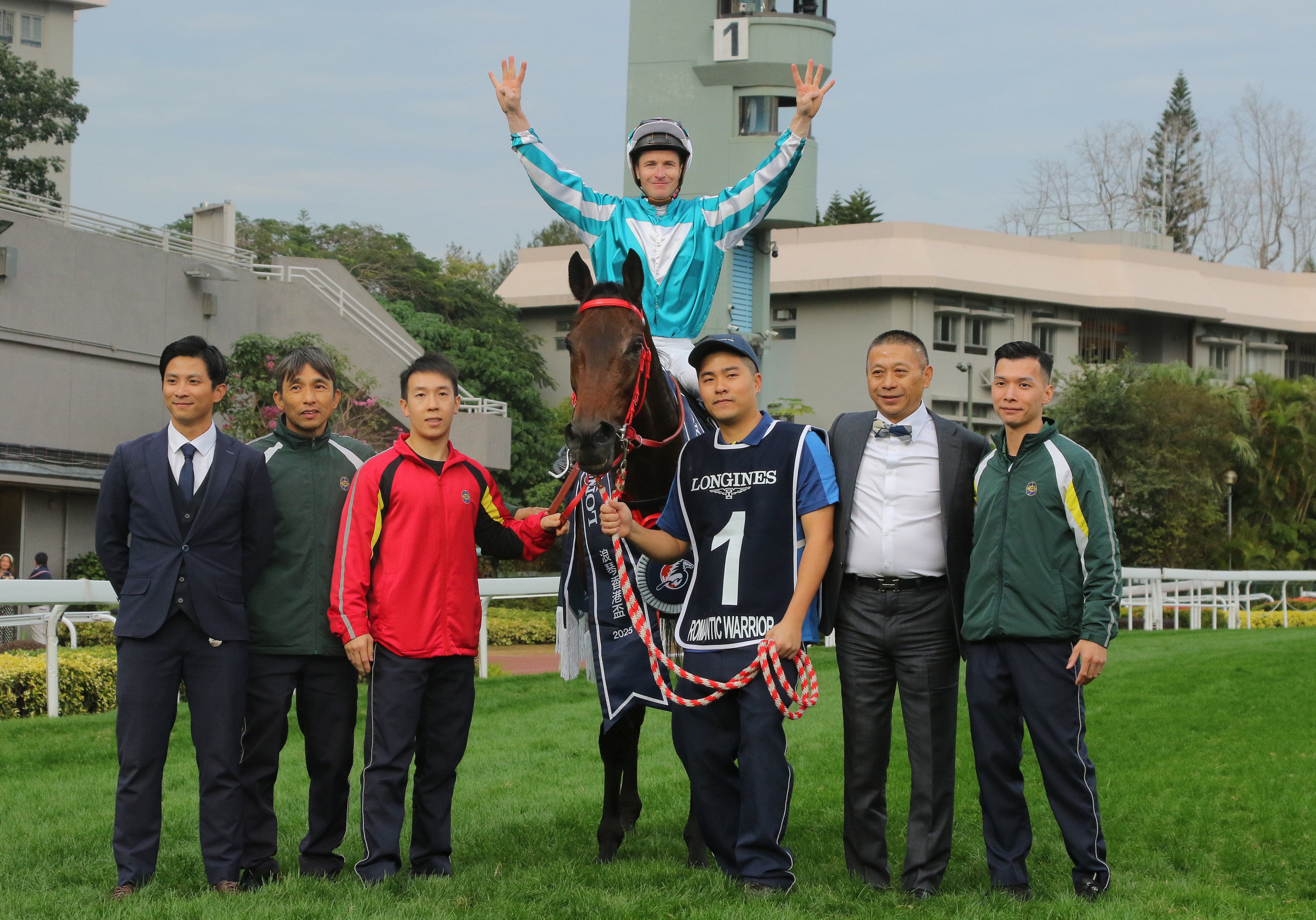 Jockey James McDonald, trainer Danny Shum (second from right) and stable staff celebrate Romantic Warrior’s fourth straight Hong Kong Cup success. Photos: Kenneth Chan