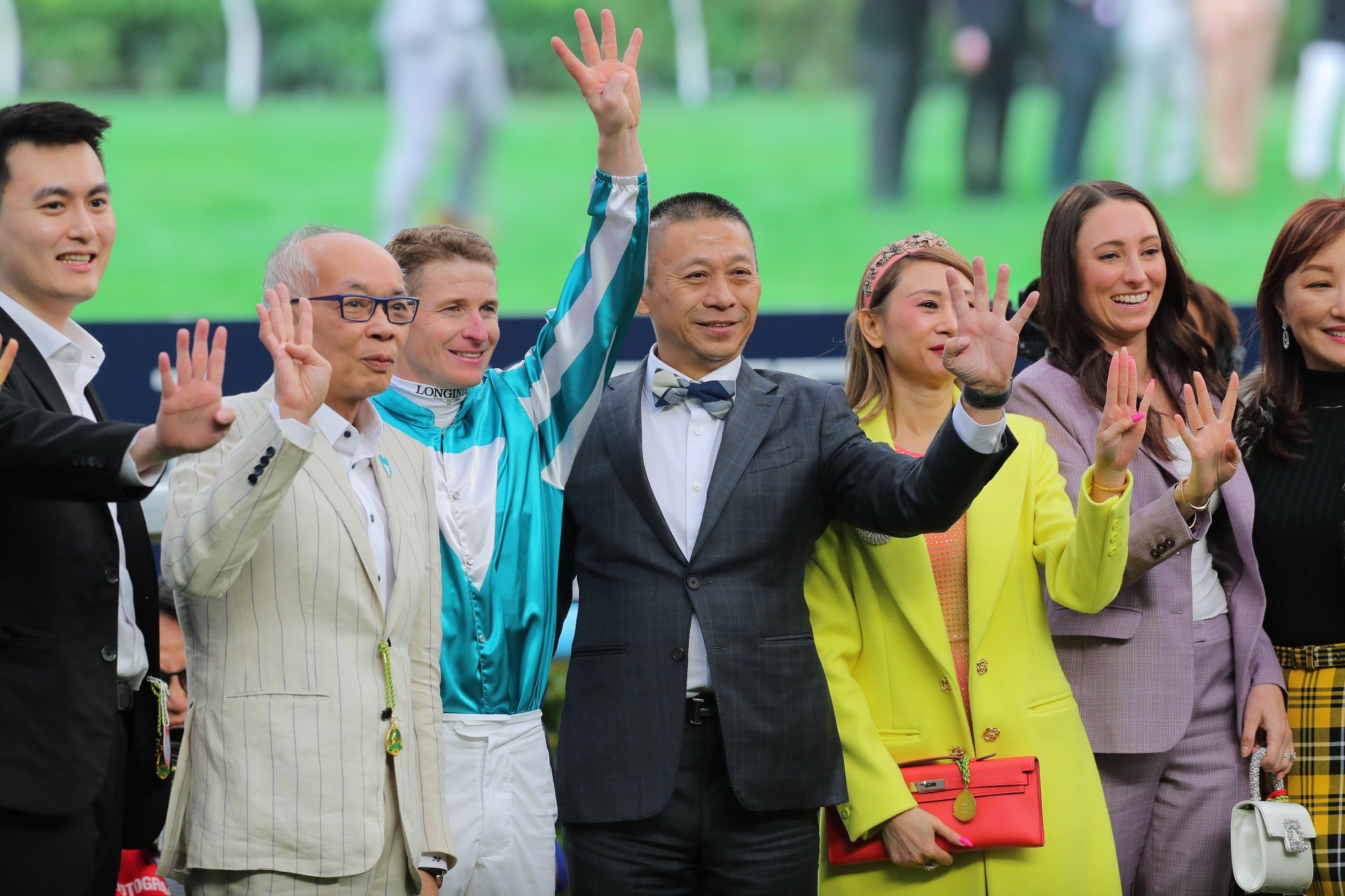 Owner Peter Lau (second from left), jockey James McDonald and trainer Danny Shum (centre) celebrate Romantic Warrior’s fourth Hong Kong Cup.