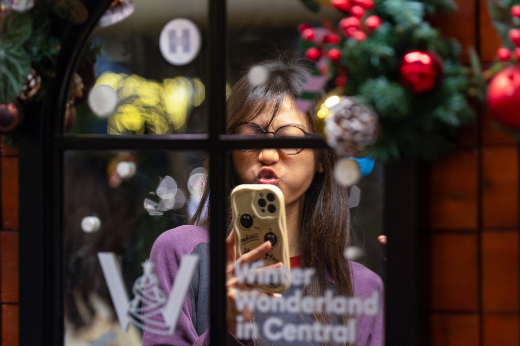 A woman visits the Christmas Town display in Central. Photo: Eugene Lee A woman visits the Christmas Town display in Central. Photo: Eugene Lee
