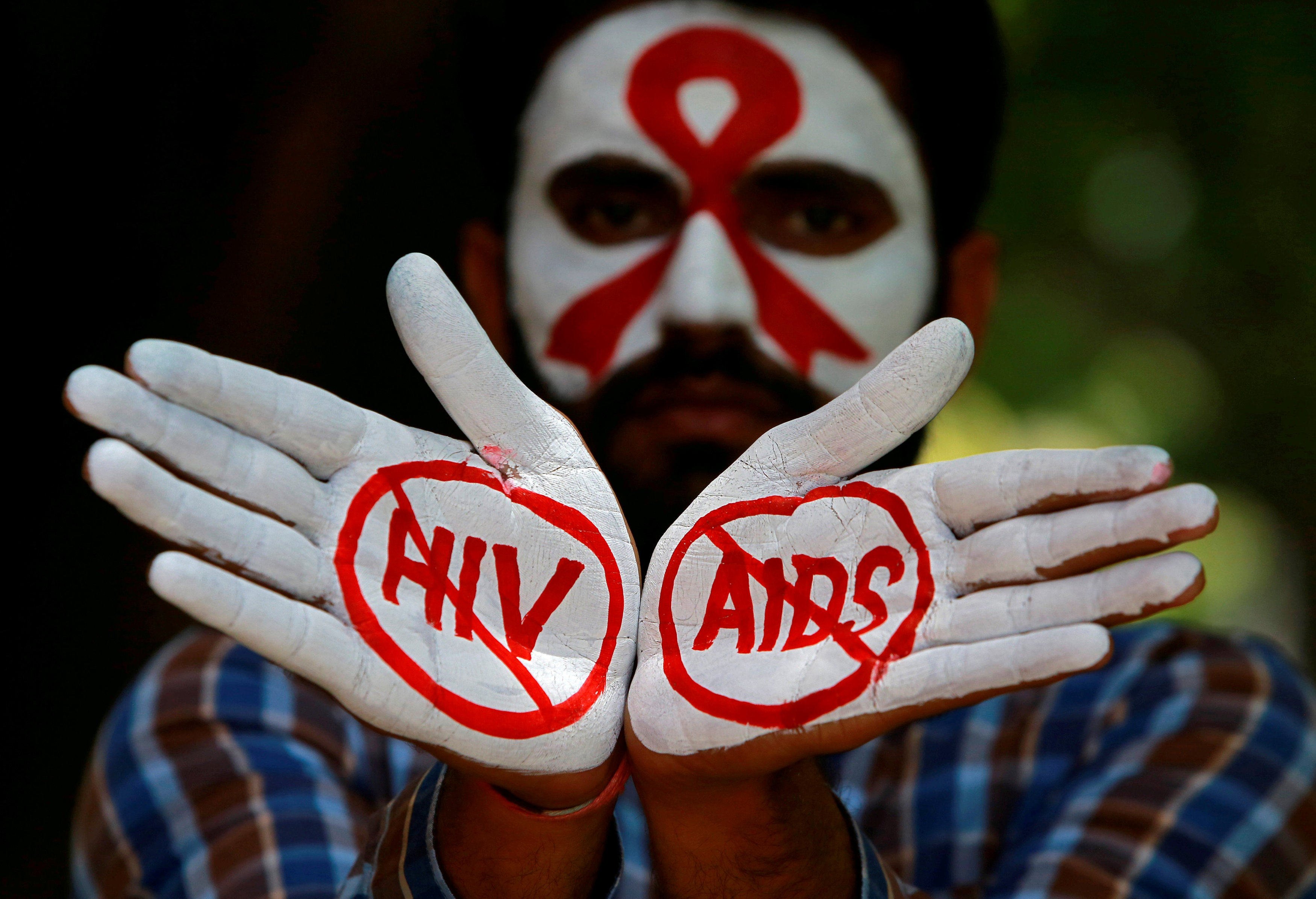 A student displays messages painted on his hands during an HIV/AIDS awareness campaign in Chandigarh, India. The country has made significant progress in controlling the disease, though concerns persist in some regions. Photo: Reuters