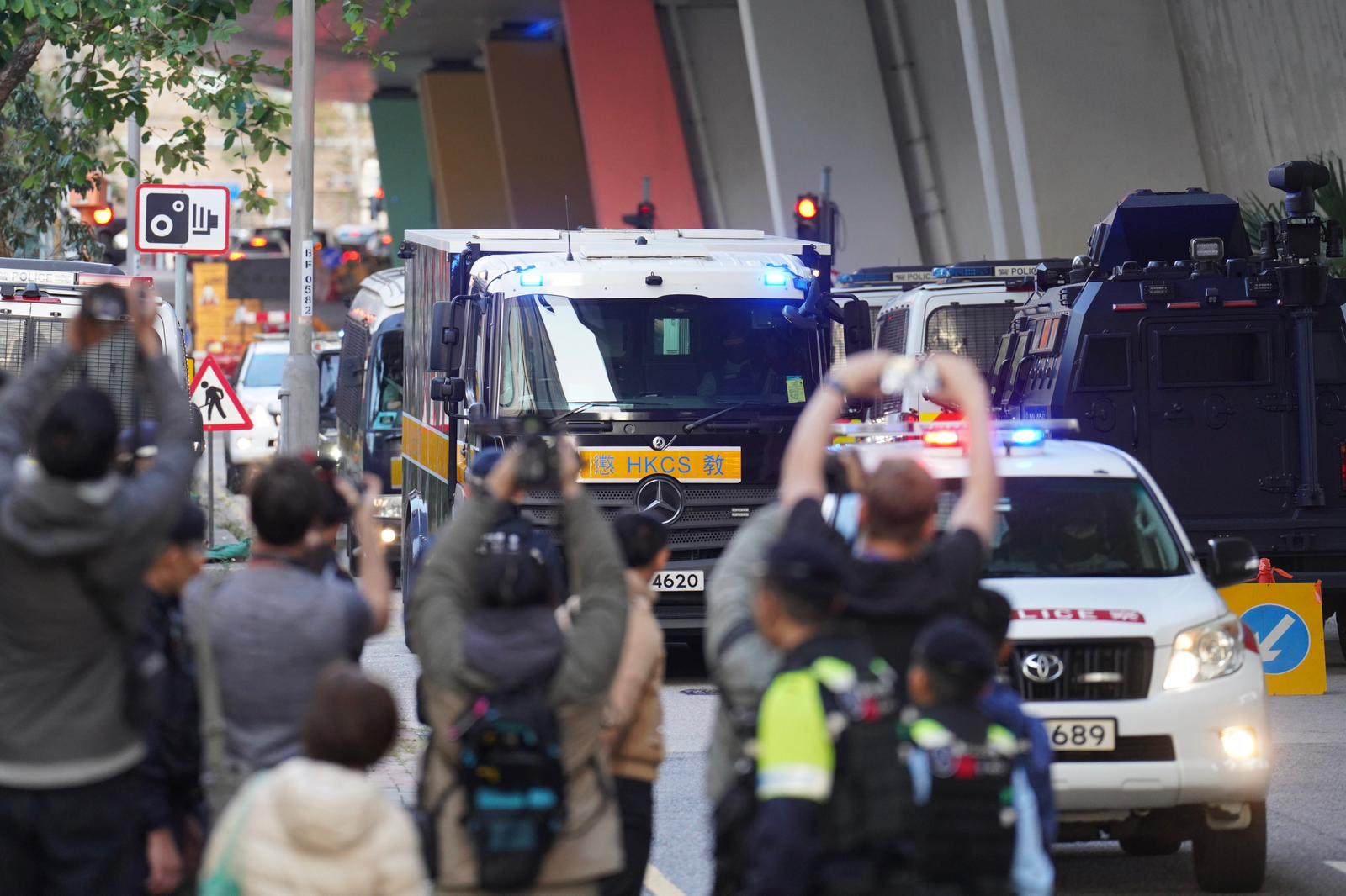 A Correctional Services Department vehicle carrying Jimmy Lai is escorted by police to the court. Photo: Karma Lo