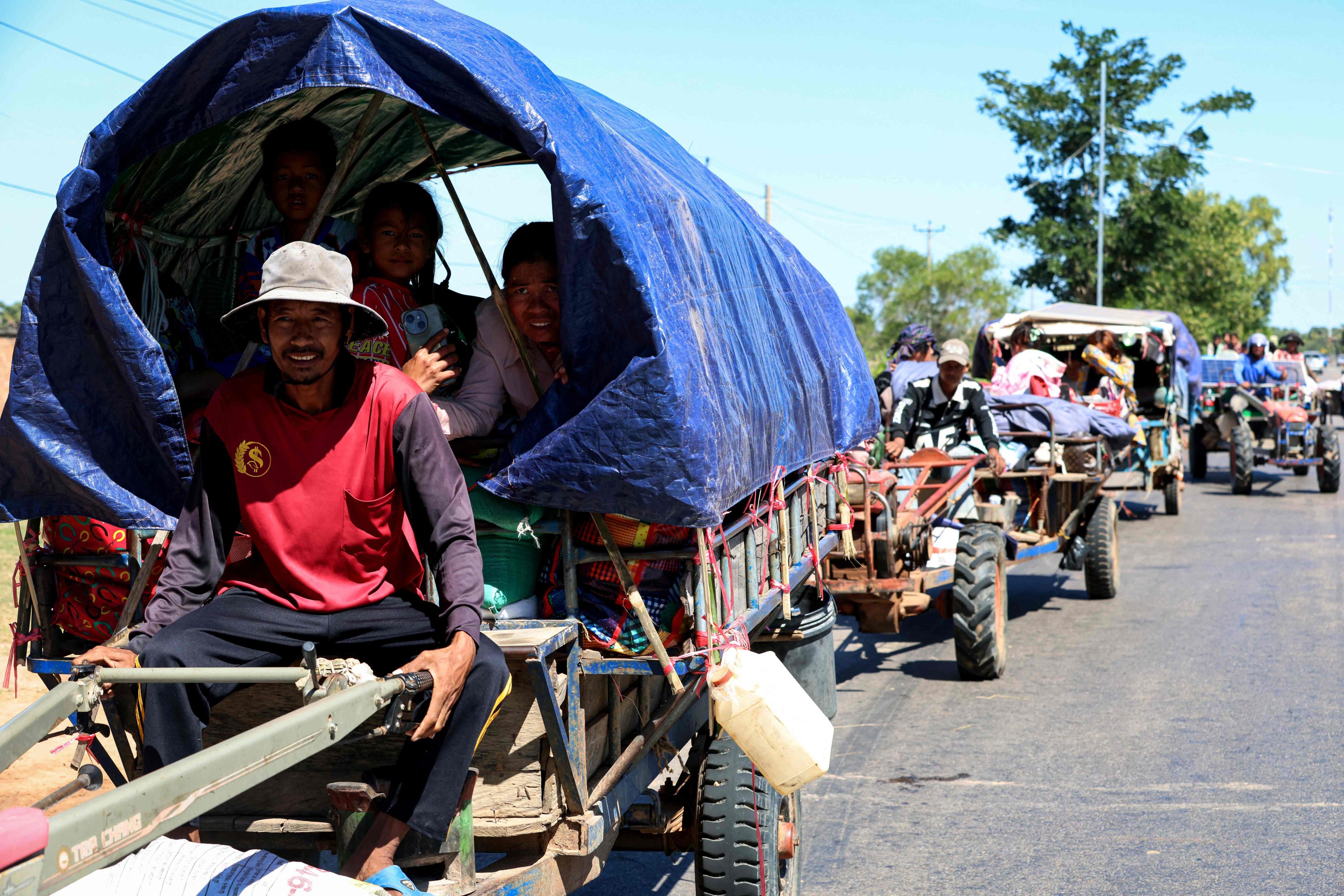 Residents evacuate following air strikes in Cambodia’s Siem Reap province, amid clashes along the Cambodia-Thailand border. Photo: Handout via Agence Kampuchea Press/AFP