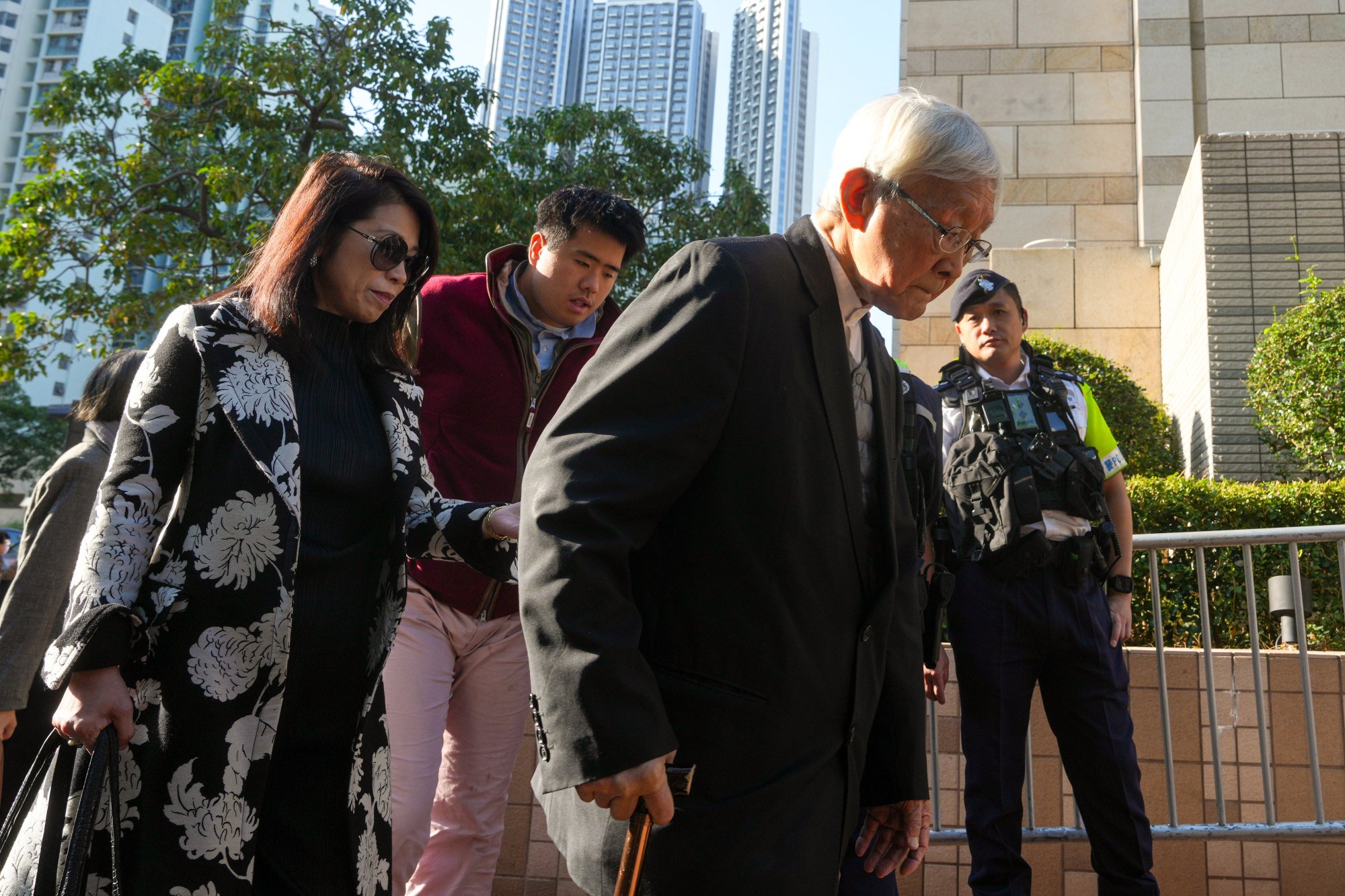 (From left) Teresa Li and Augustin Lai arrive at West Kowloon Court with Cardinal Joseph Zen. Photo: Sam Tsang