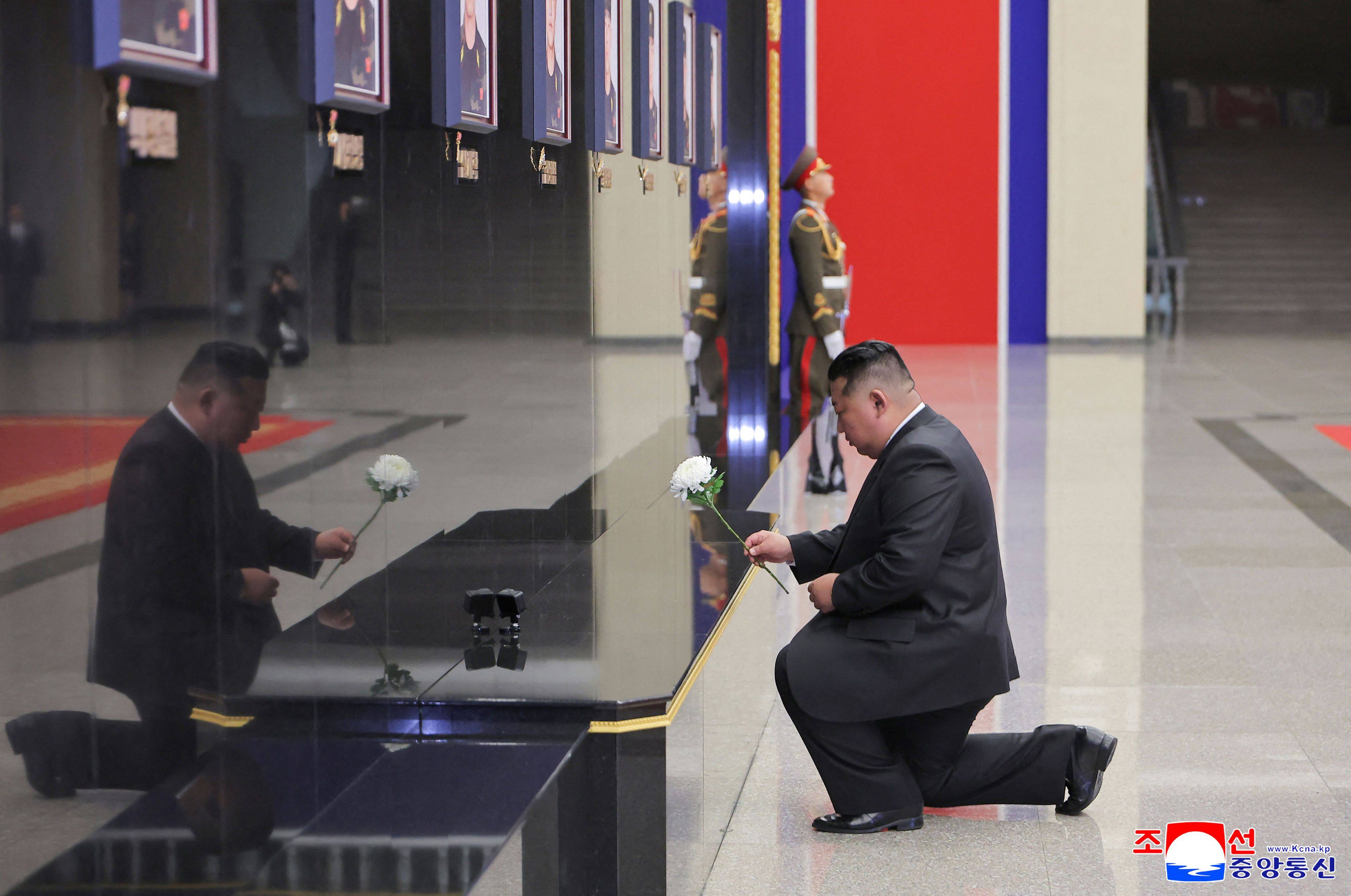 North Korean leader Kim Jong-un pays his respects in front of portraits of soldiers killed during an overseas deployment in Russia’s Kursk region, during a ceremony in Pyongyang on Friday. Photo: AFP