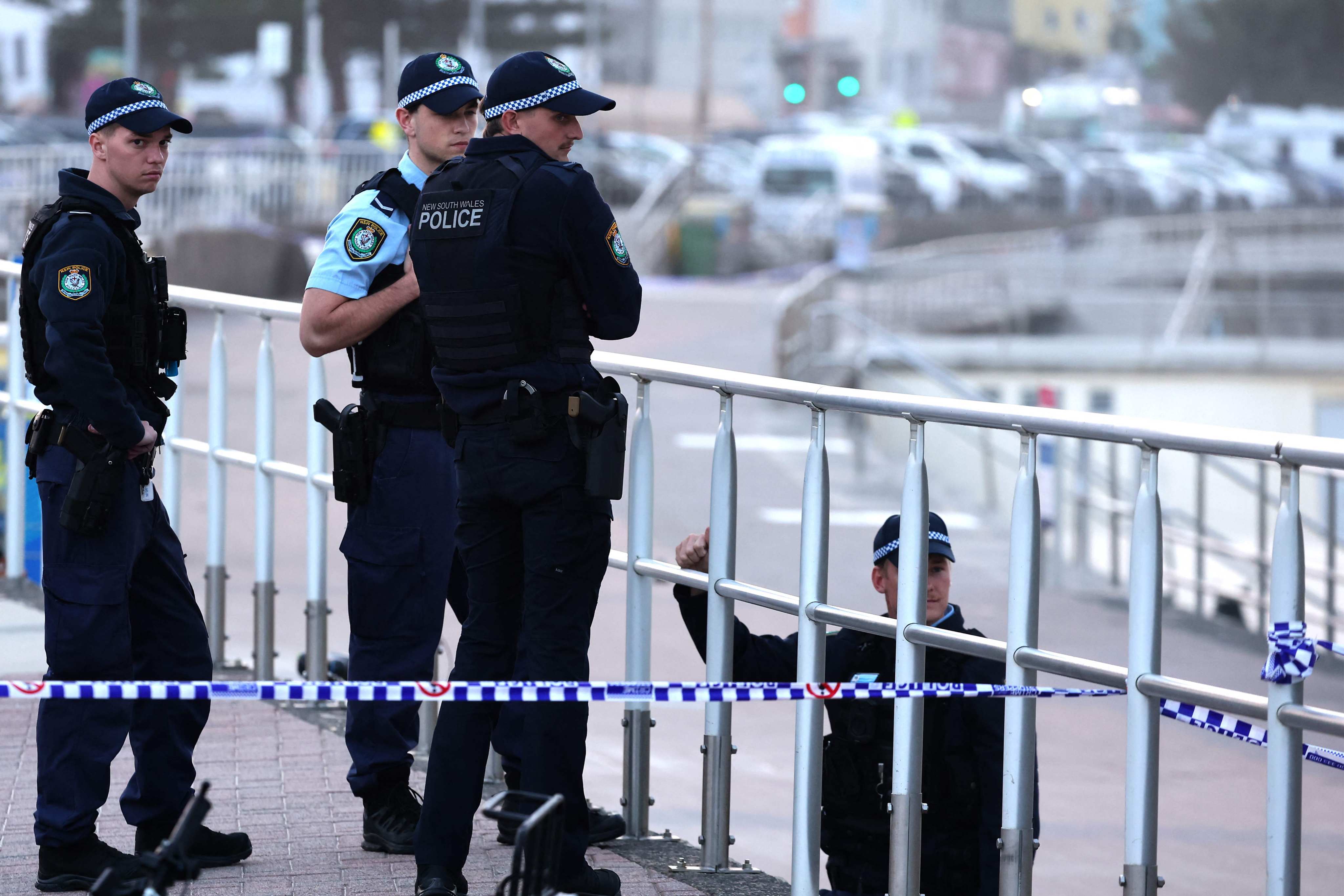 Police patrol Bondi Beach on Monday as they investigate the scene following a shooting in Sydney on Sunday. Photo: AFP