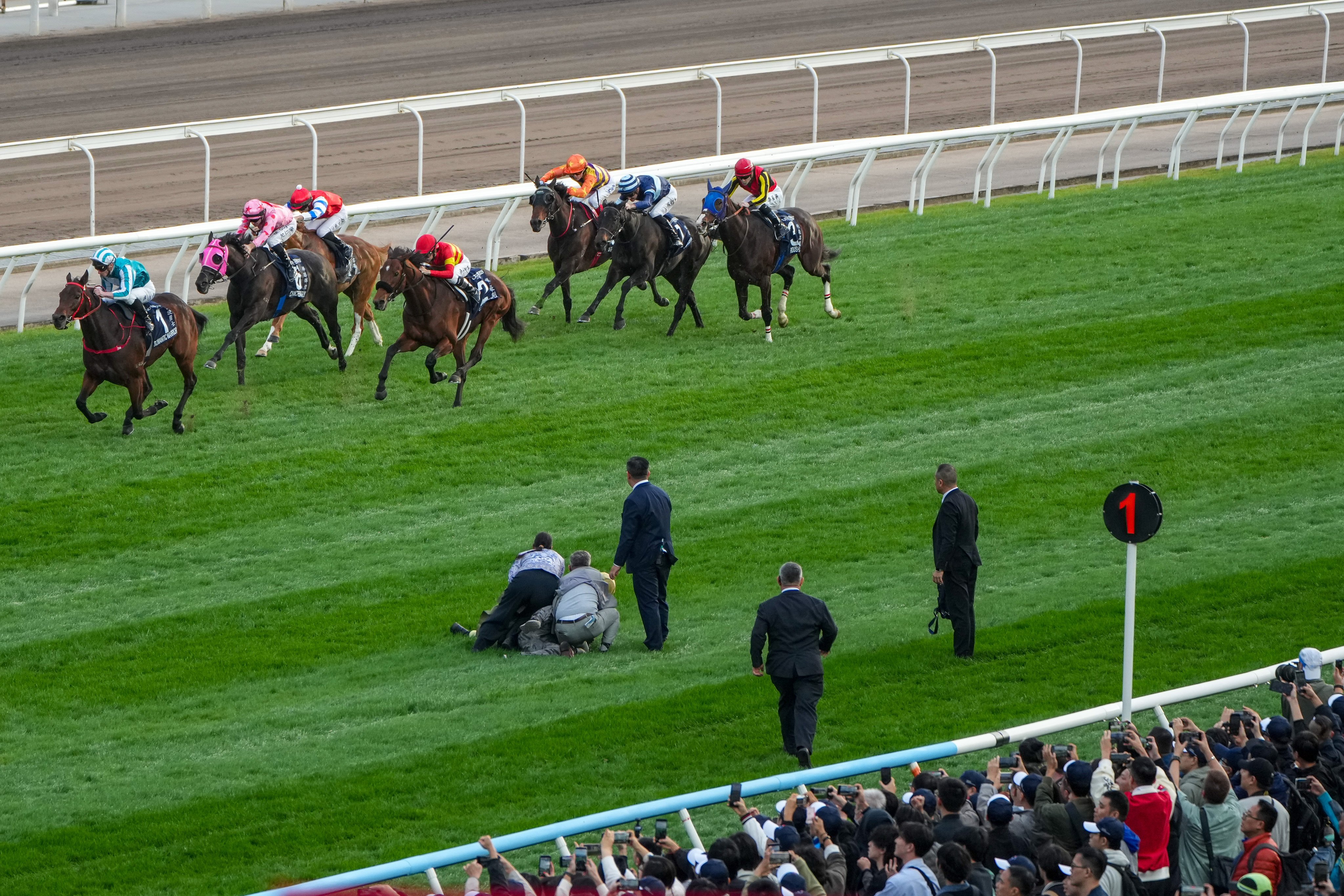 The track invader is held still while the Group One Hong Kong Cup field approaches at Sha Tin on Sunday. Photo: Sam Tsang