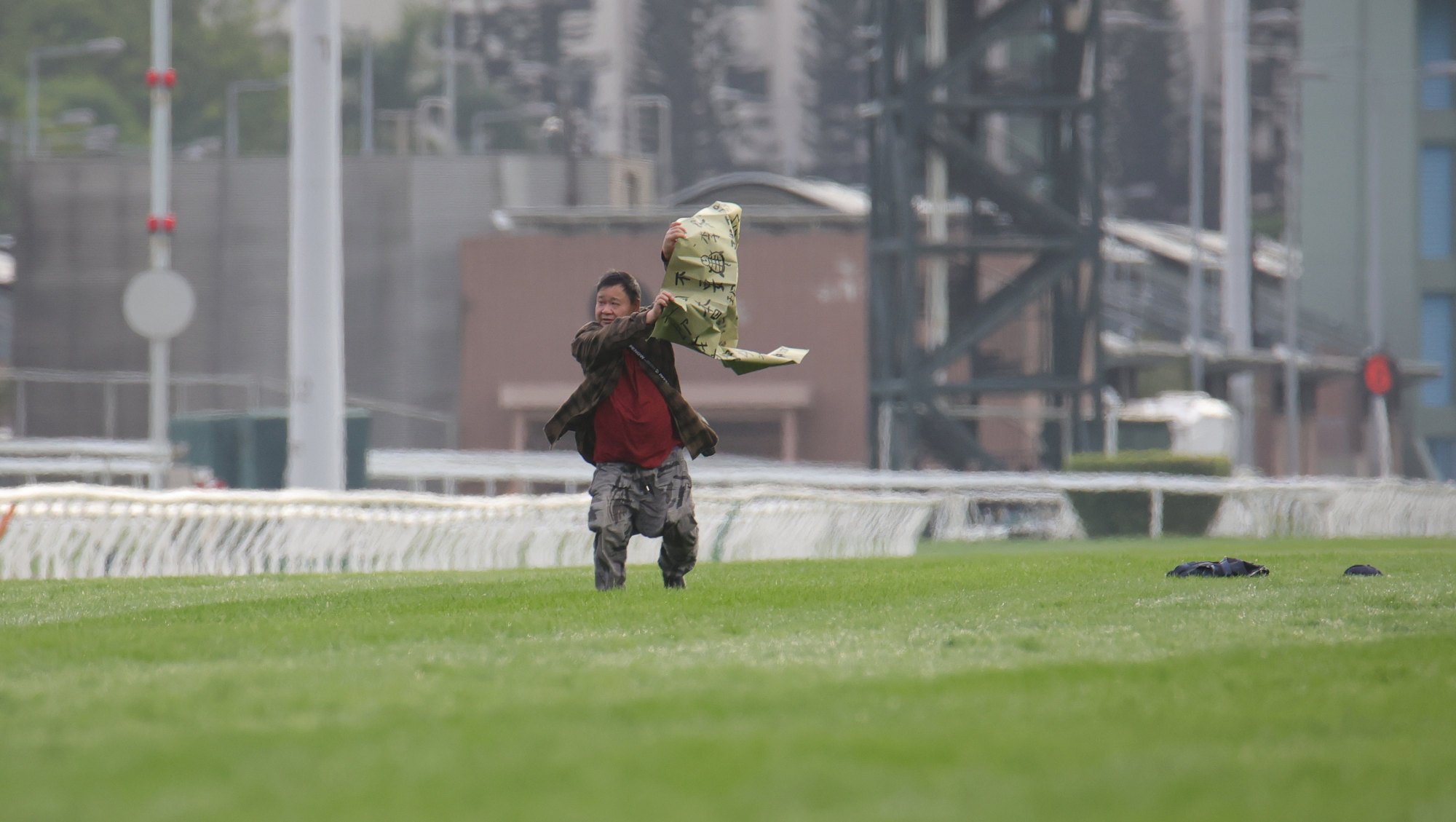 A protestor ran onto the Sha Tin track during Sunday’s Hong Kong Cup.