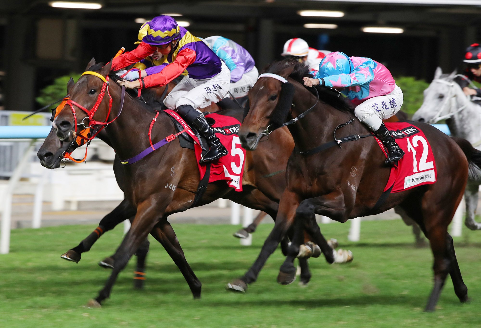Andrea Atzeni (outside) gets Super Unicorn up in the nick of time at Happy Valley.