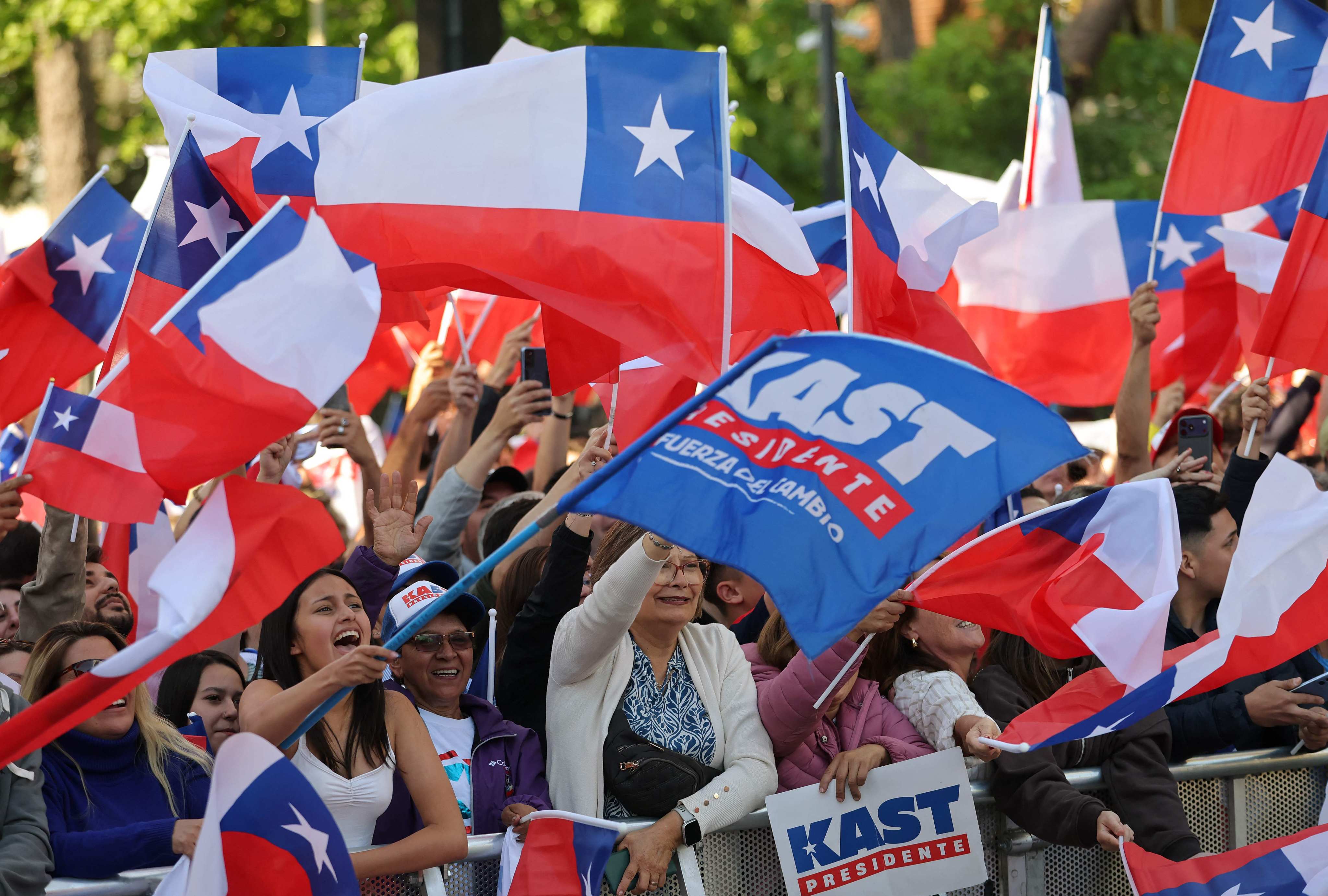 Supporters of Chile’s winning presidential candidate Jose Antonio Kast react as the first election results are announced on Sunday. Photo: AFP