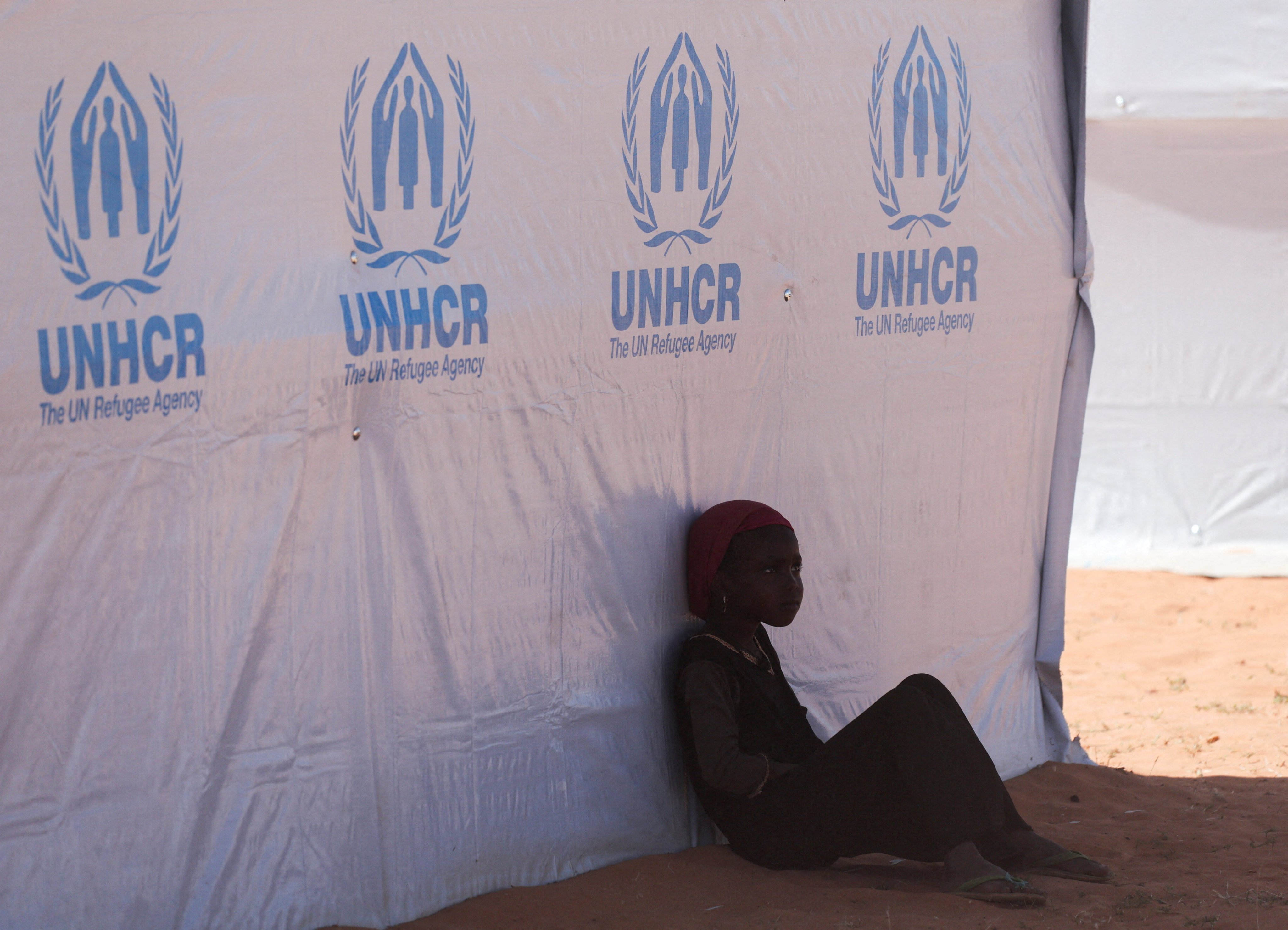 A Sudanese girl from Darfur rests beside a United Nations High Commissioner for Refugees tent inside the Touloum refugee camp on the outskirts of Iriba in Wadi Fira province, eastern Chad, on November 30. Photo: Reuters