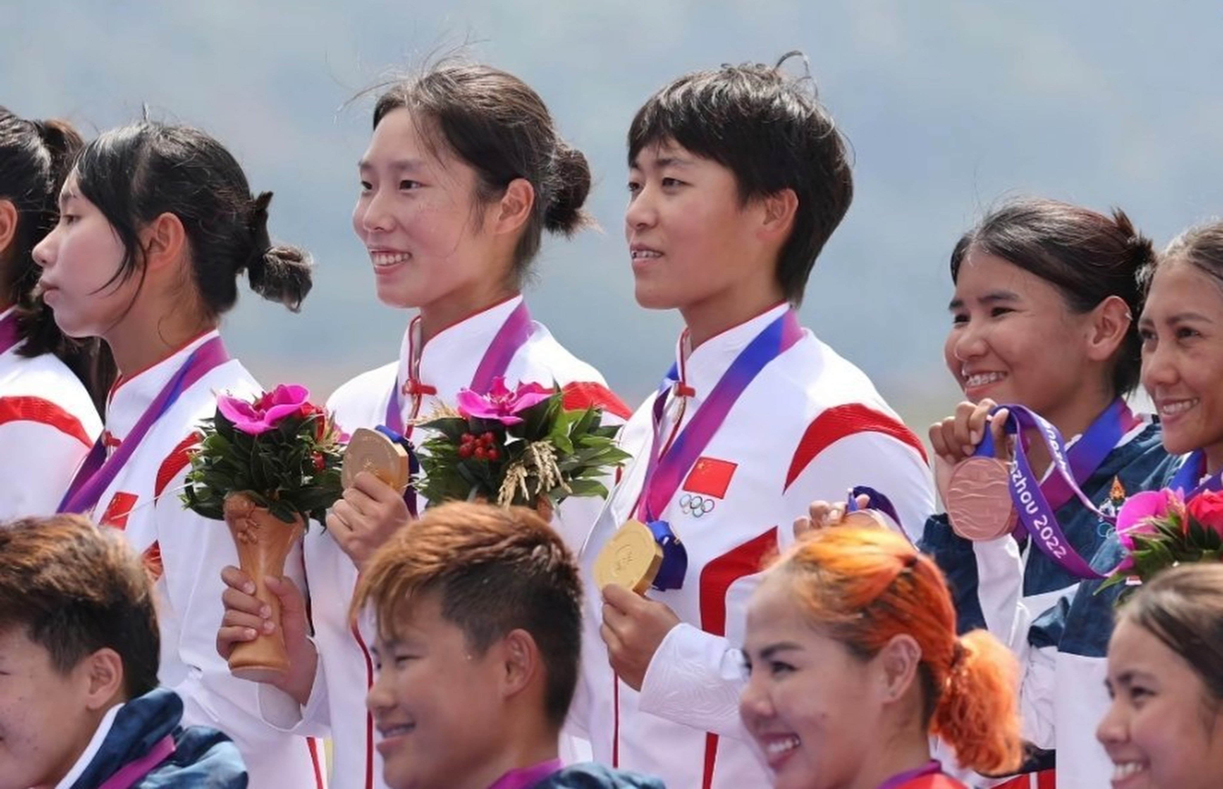 China’s Wang Li (centre, with short hair) receives one of the three gold medals she won at the Asian Games in Hangzhou in 2023. Photo: SCMP