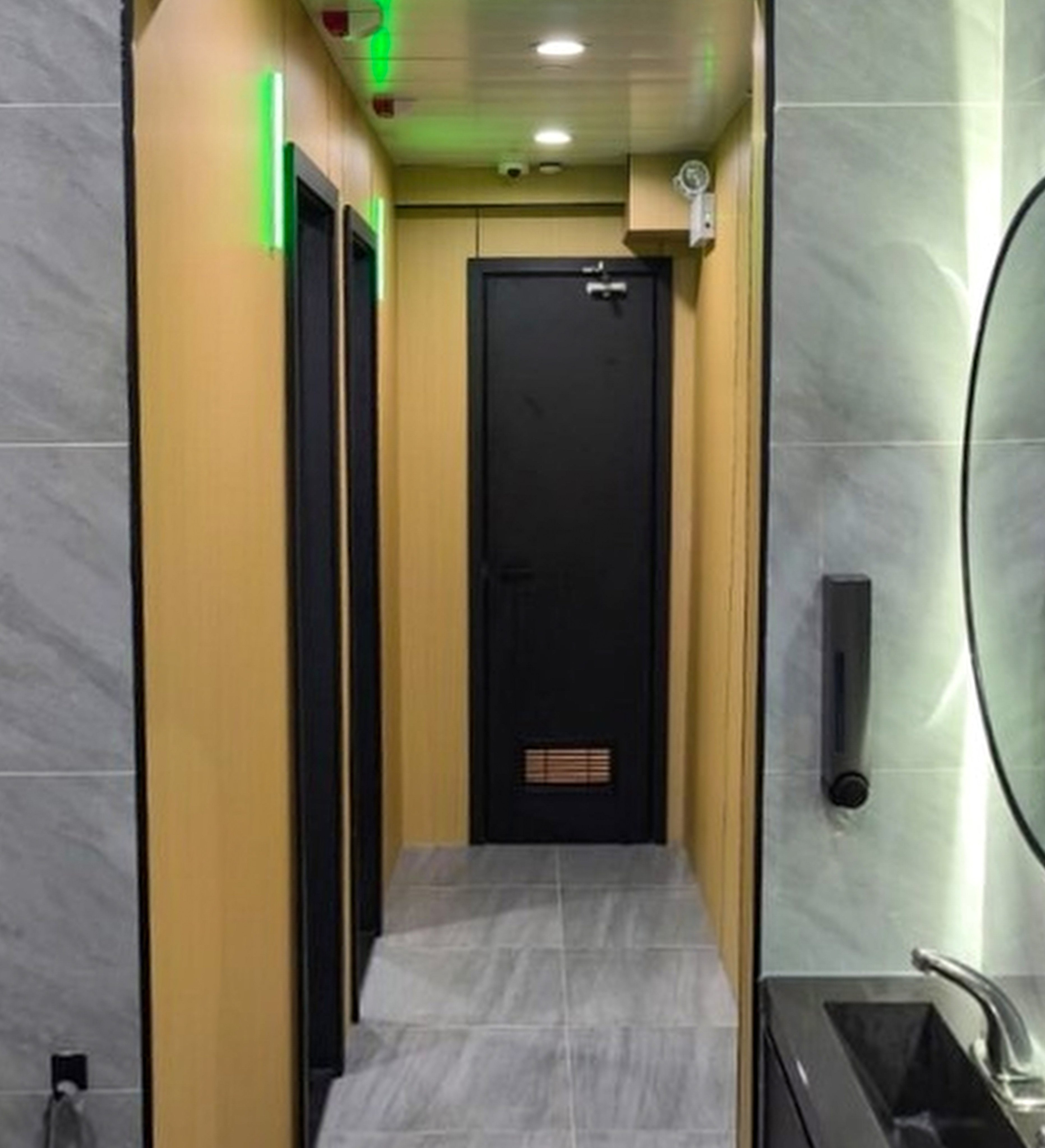 The camera at a branch of a fitness chain was positioned on the ceiling above the door facing three restrooms, one of which was doorless. Photo: Handout