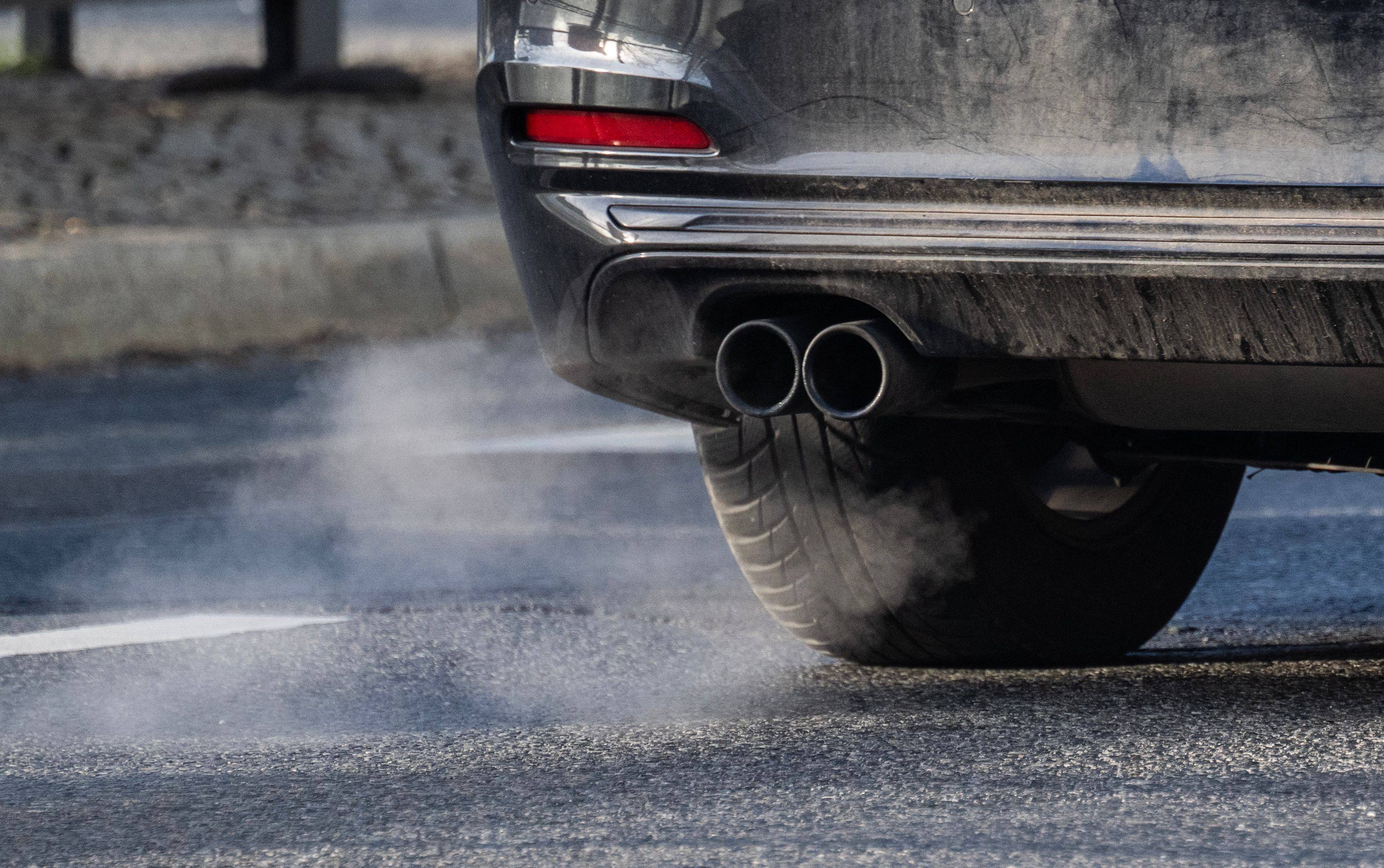 Fumes emerge from the exhaust pipe of a car with a combustible engine in Berlin on Tuesday. Photo: AFP