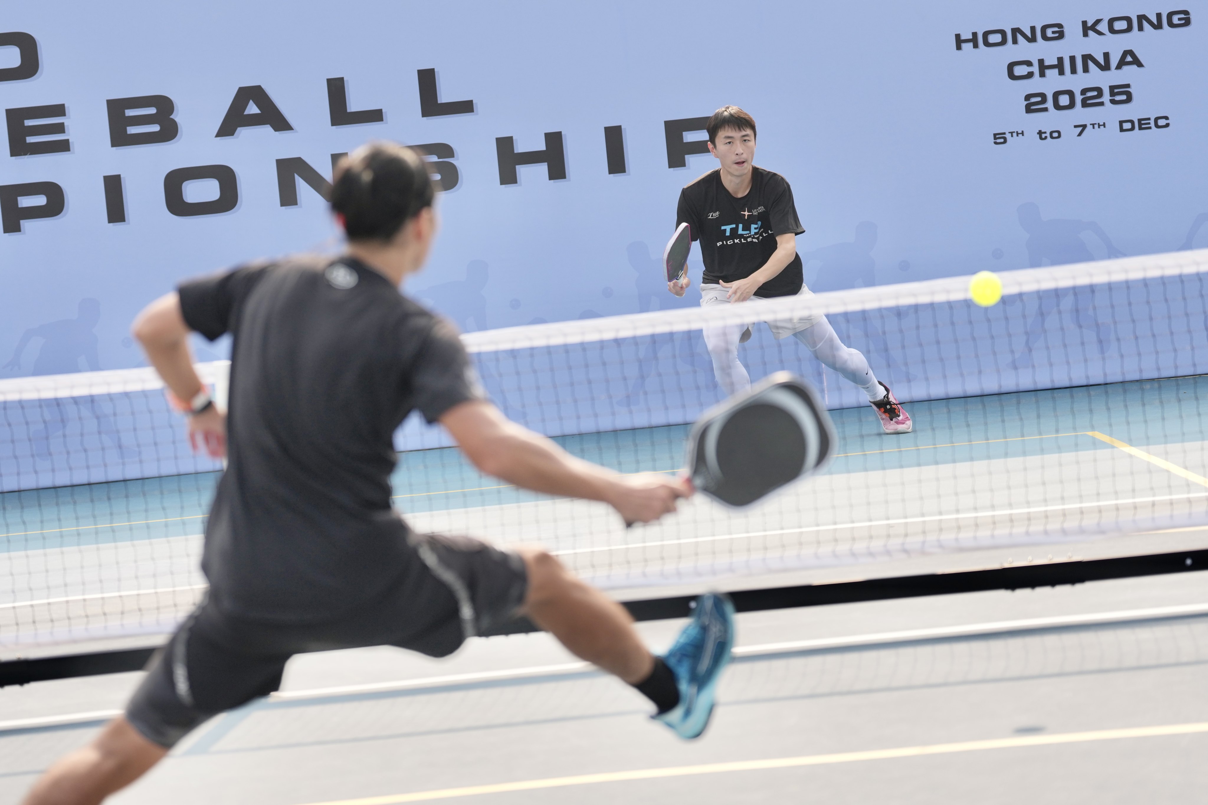 Ryan Lam Chun-hei (right) competes against Yuichiro Aoki at the World Pickleball Championships at Discovery Bay Recreation Club on Lantau Island in early December. Photo: Karma Lo