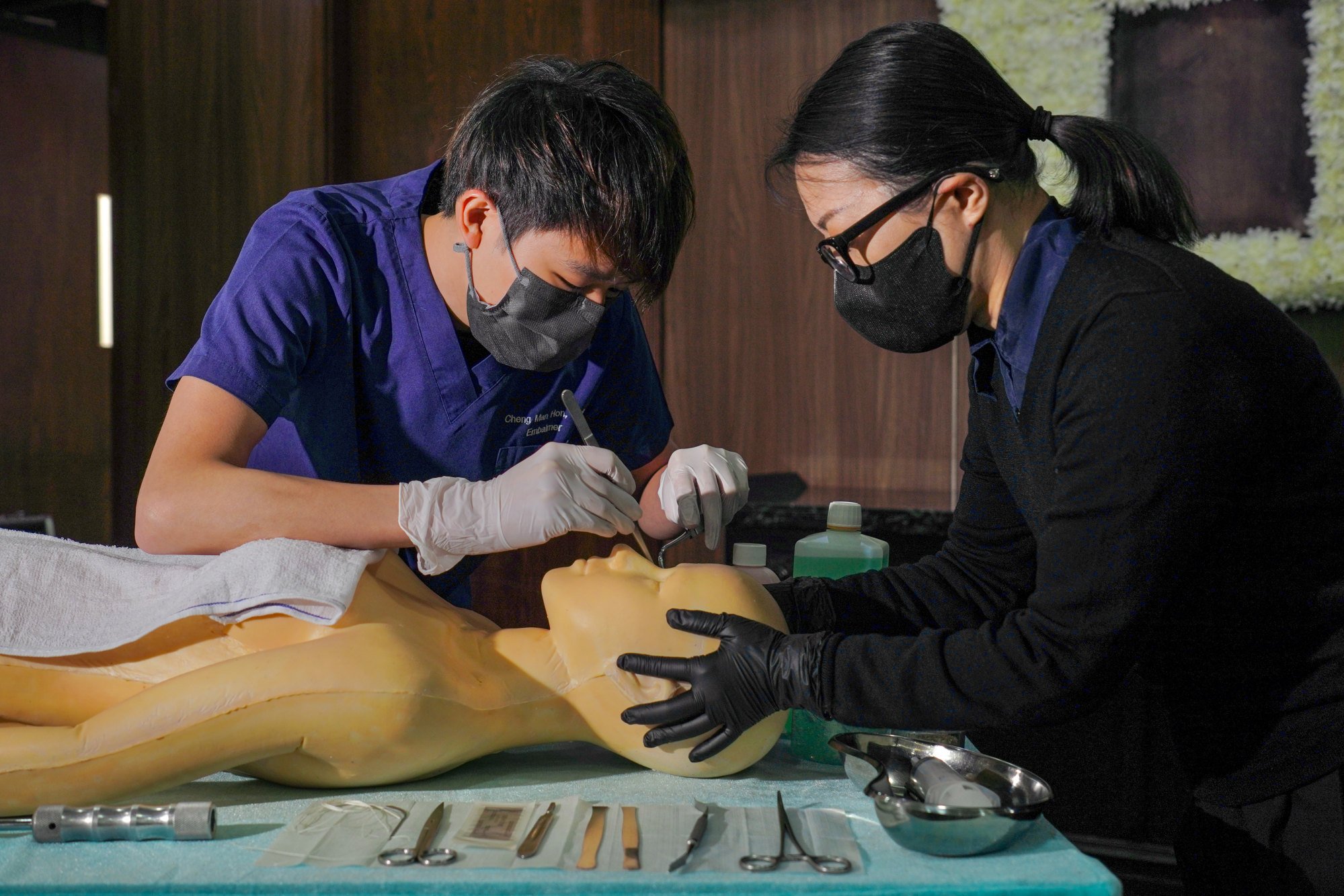 Embalmer Nick Cheng (left) and body make-up artist Vangie Lee at the parlour. Photo: Karma Lo