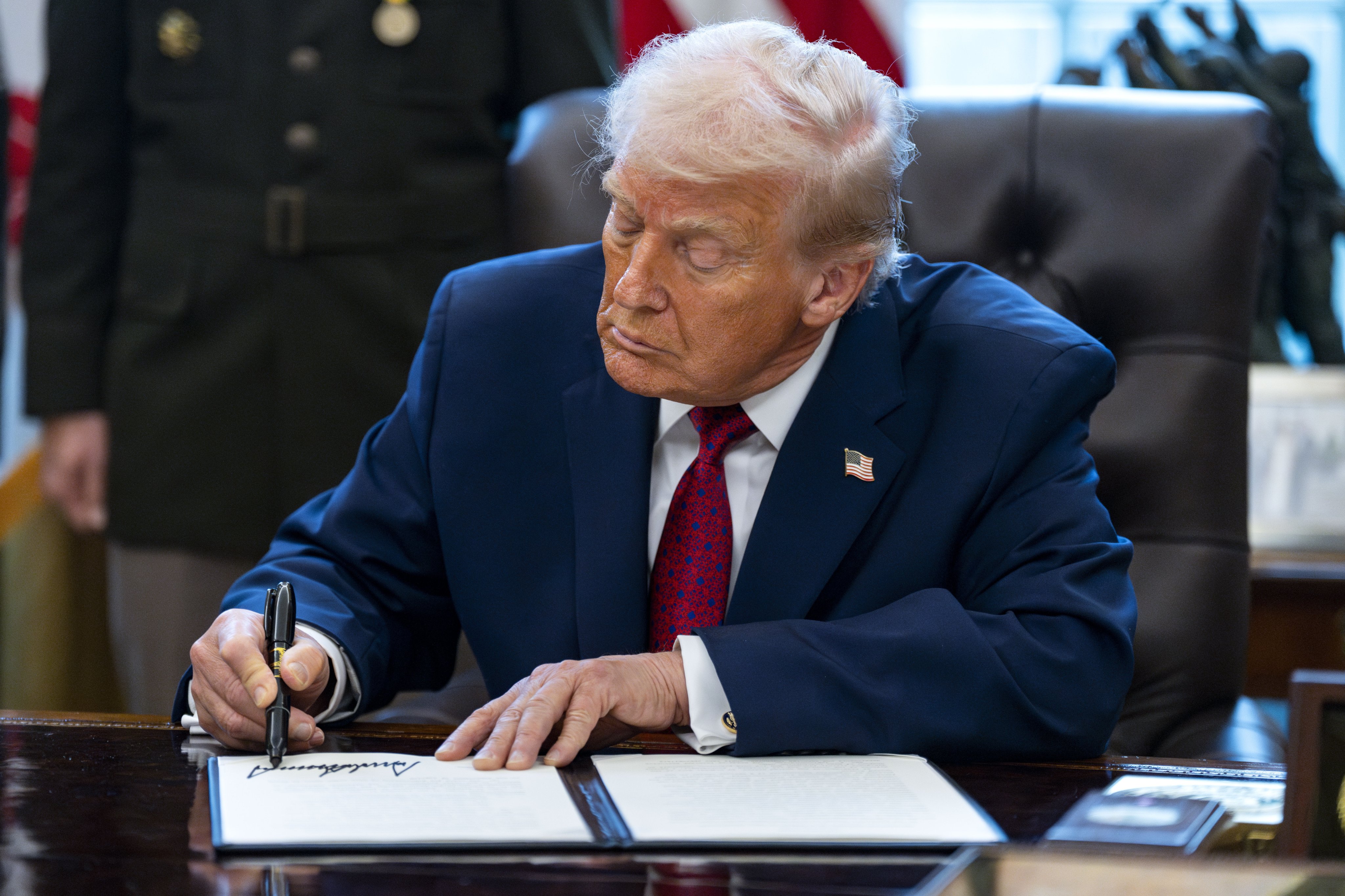 US President Donald Trump signs an executive order designating fentanyl, a powerful synthetic opioid, as a weapon of mass destruction, in the Oval Office of the White House in Washington on Monday. Photo: EPA