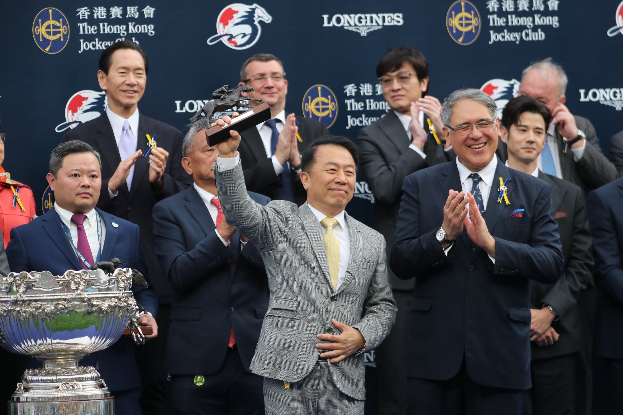 Trainer Ricky Yiu with the Hong Kong Mile trophy after Voyage Bubble’s win last Sunday.