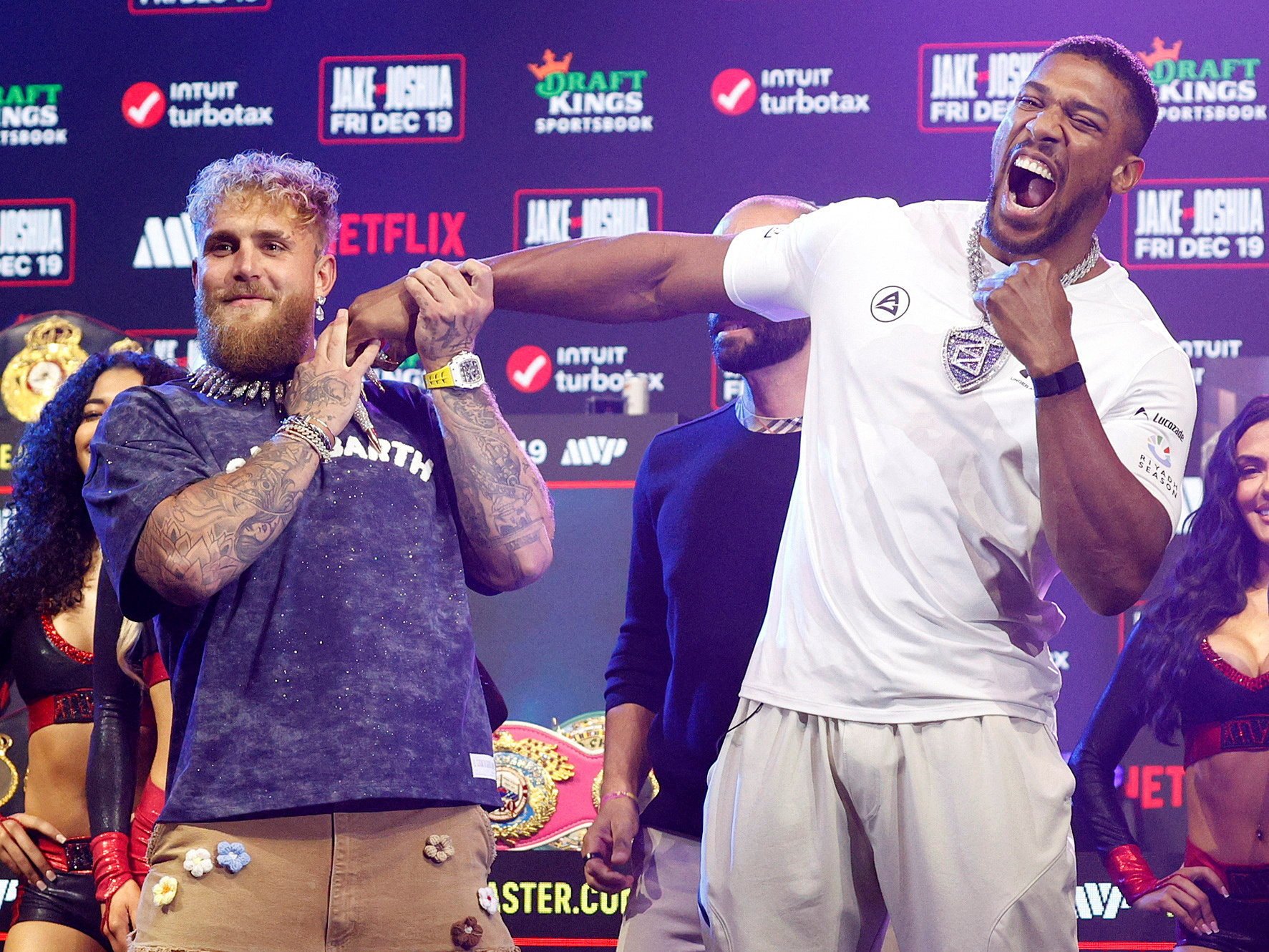 Jake Paul (left) and Anthony Joshua clown around during their press conference in Miami on Wednesday. Photo: Reuters