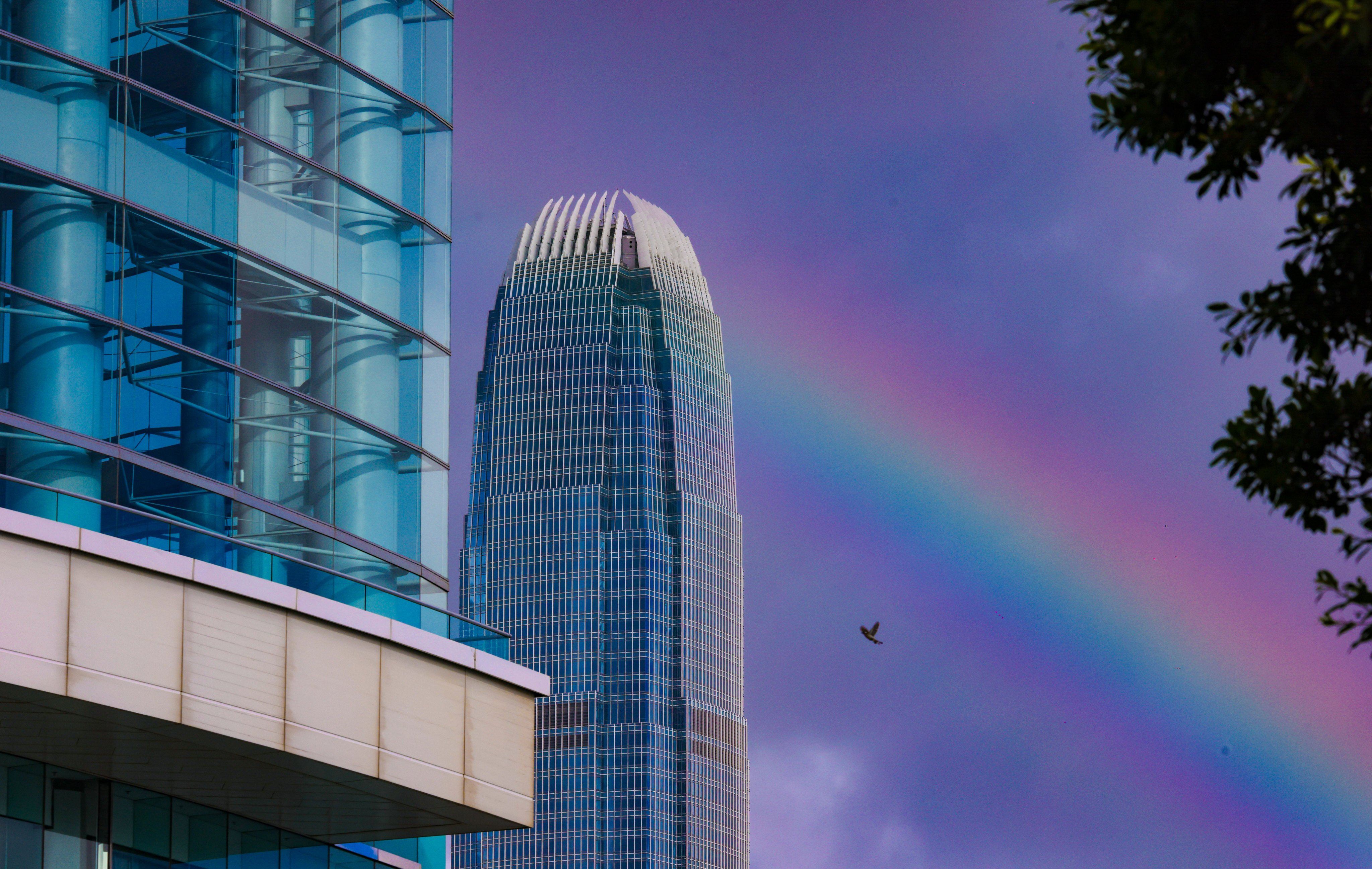 A rainbow is seen behind the International Finance Centre (IFC) in Central, with the Hong Kong Convention and Exhibition Centre in the foreground, July 1, 2025. Photo: Nora Tam