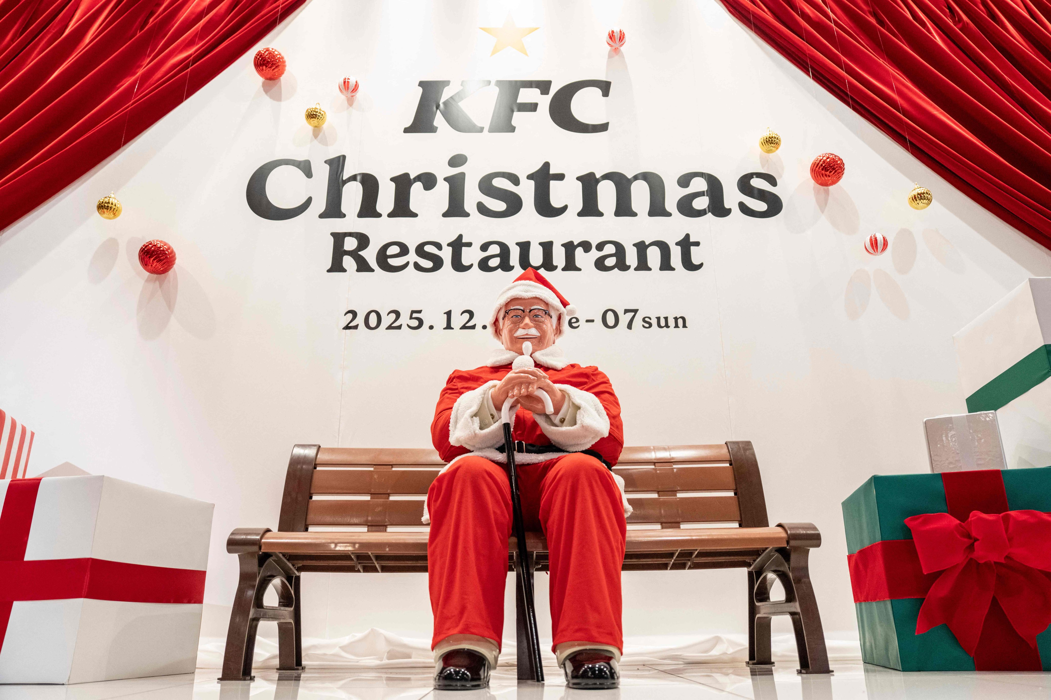 A statue of Colonel Sanders is dressed as Santa Claus at a KFC Christmas restaurant in Tokyo. Photo: AFP