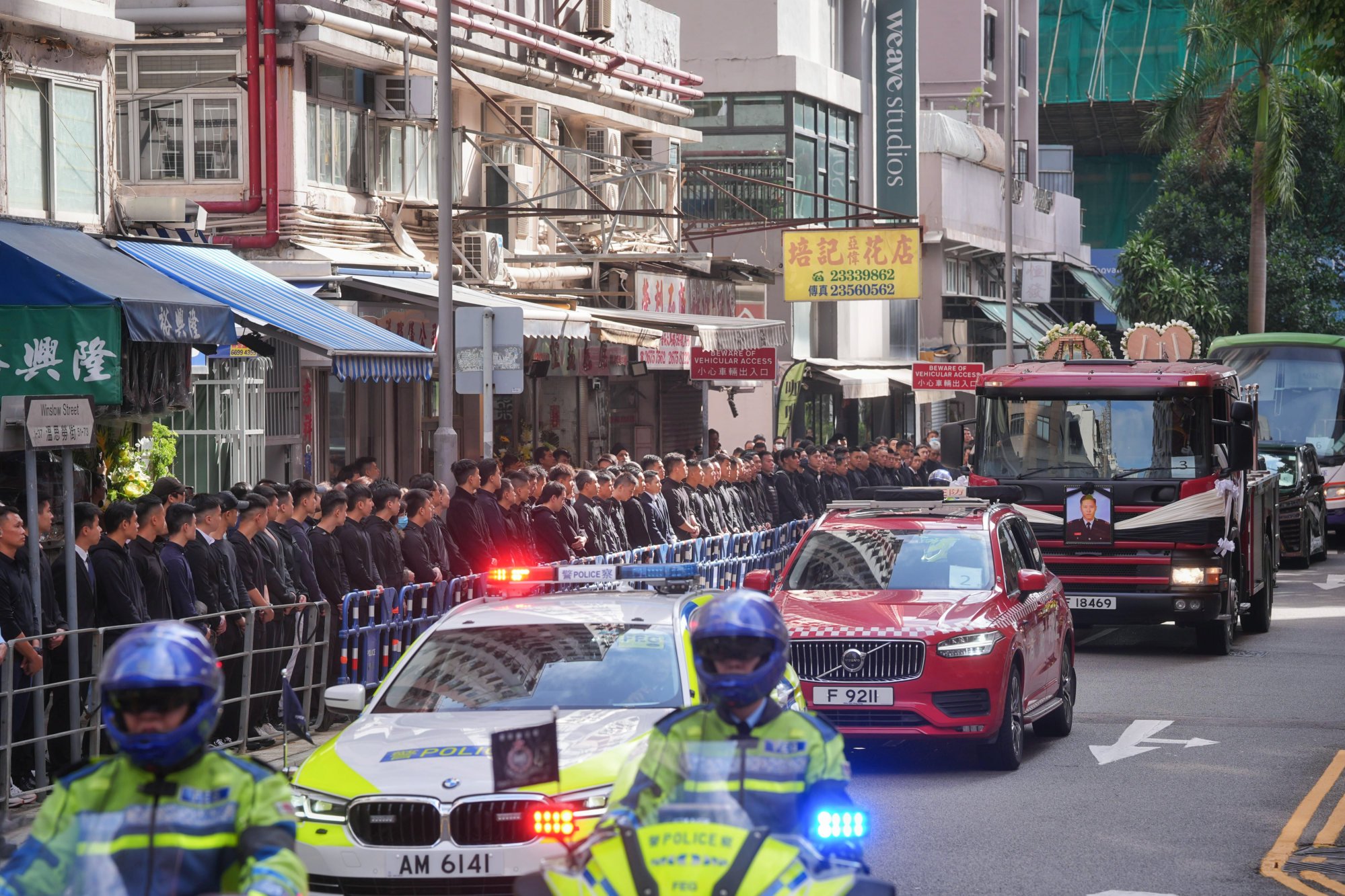 The funeral procession for fallen firefighter Ho Wai-ho on Friday morning. Photo: Elson Li The funeral procession for fallen firefighter Ho Wai-ho on Friday morning. Photo: Elson Li