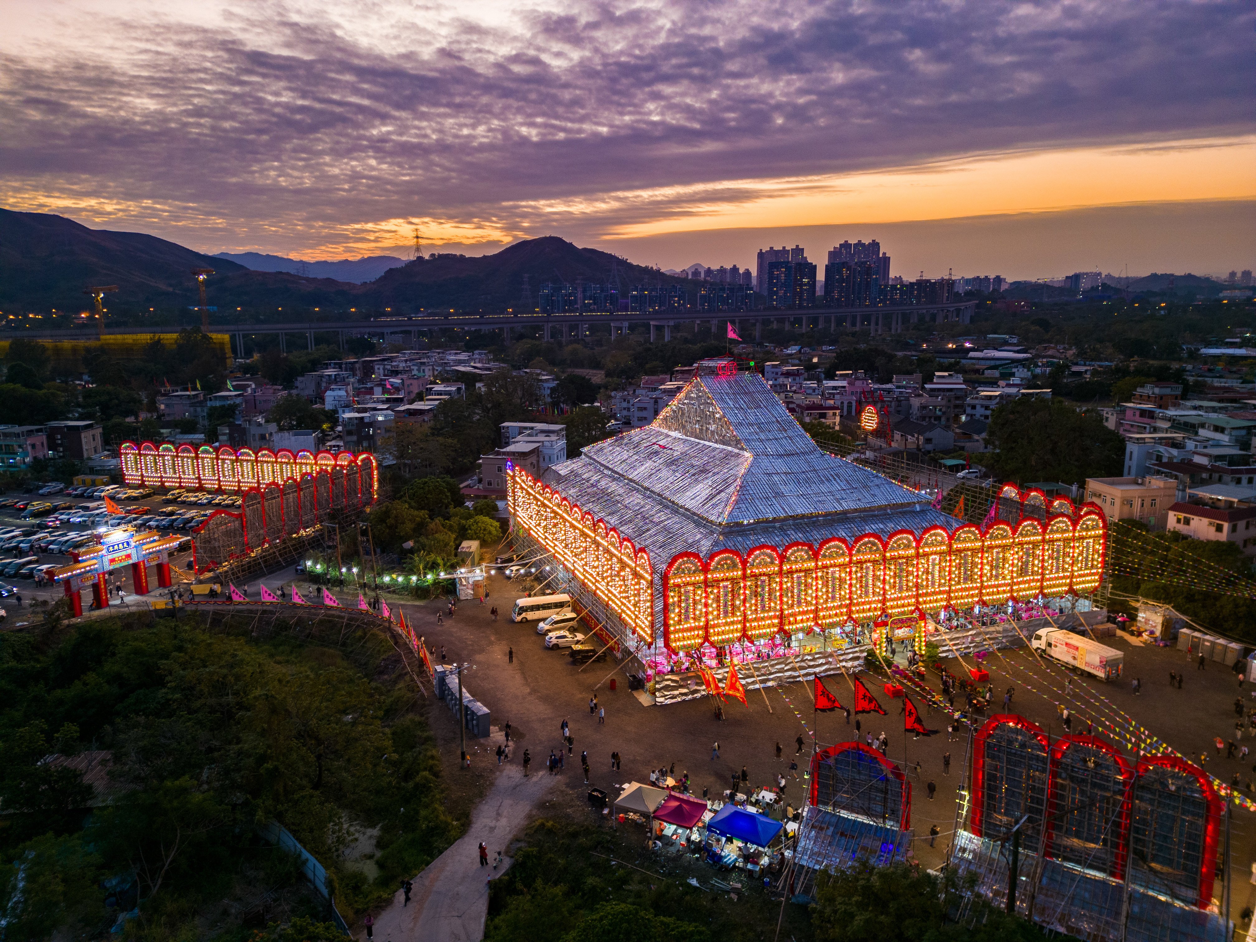 The giant bamboo scaffold at Kam Tin is lit up at sunset during the Jiao Festival, which is held once every 10 years, on December 15. Photo: Eugene Lee