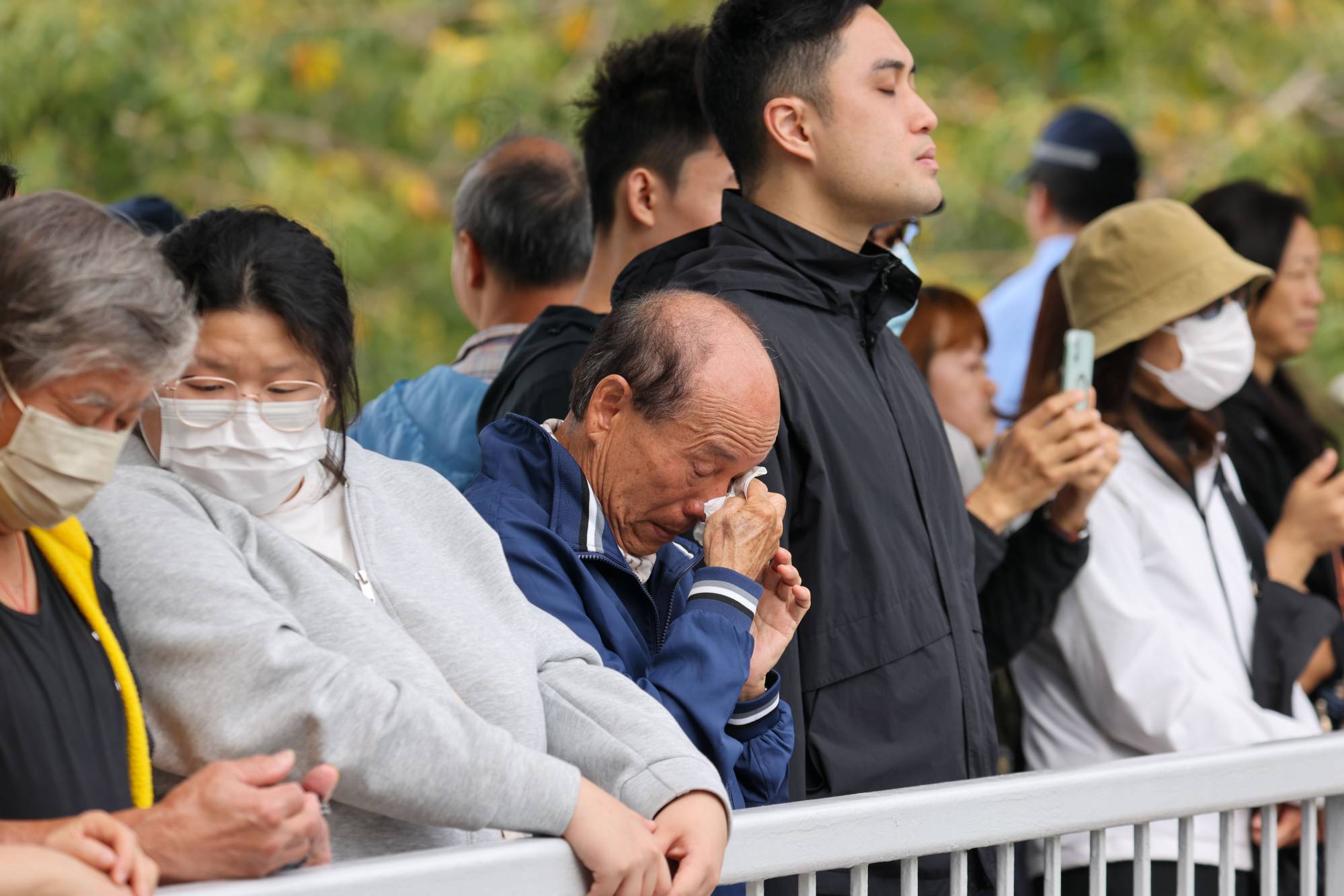 Hongkongers young and old line the streets to mourn Ho Wai-ho, the firefighter who died while battling the catastrophic blaze at Wang Fuk Court last month. Photo: Nora Tam Hongkongers young and old line the streets to mourn Ho Wai-ho, the firefighter who died while battling the catastrophic blaze at Wang Fuk Court last month. Photo: Nora Tam