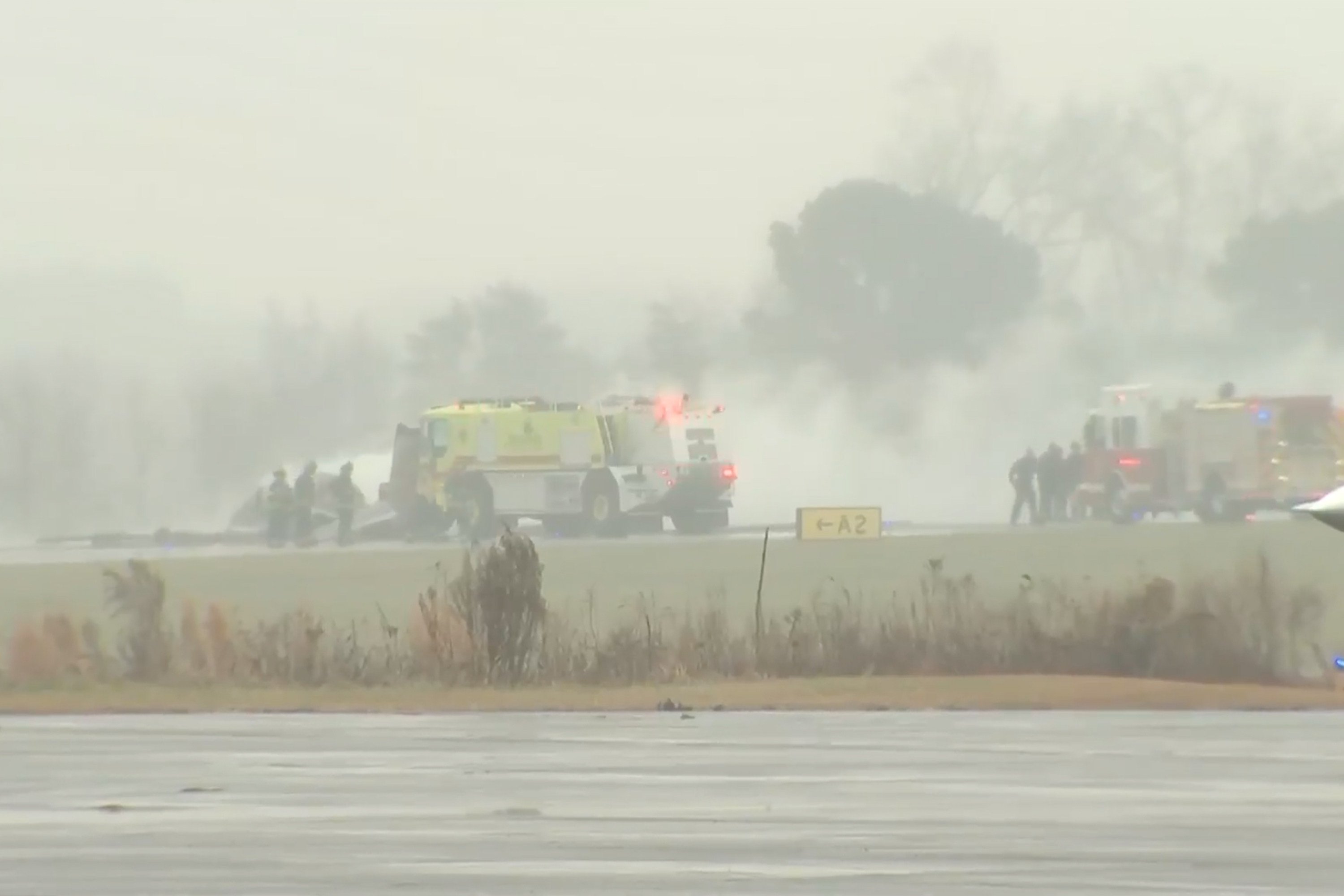 Firefighters respond to a plane crash at a regional airport in Statesville, North Carolina, on Thursday. Photo: WSOC via AP