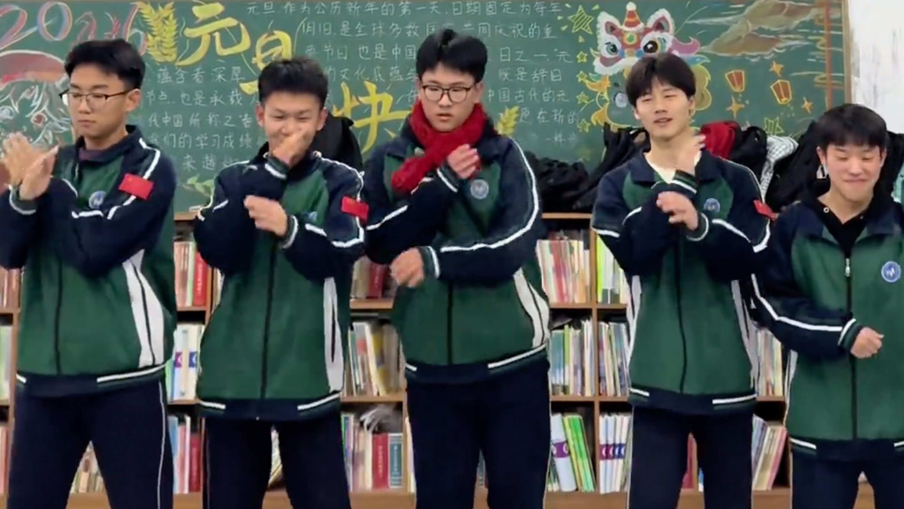 A teacher in China has turned a group of tardy boys into a “wrongdoers boy band” and made them dance on a podium to outdated music as punishment. Photo: Douyin