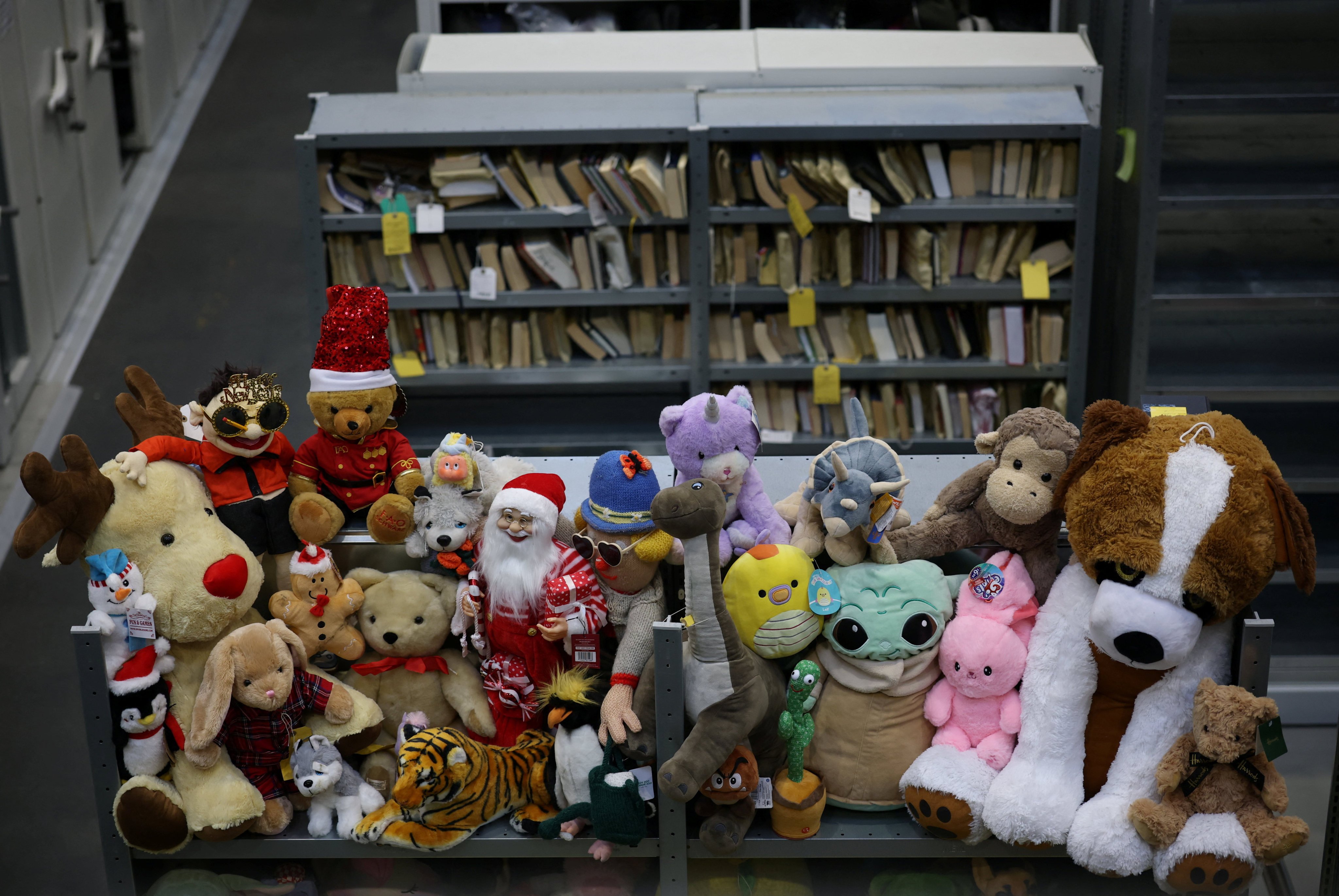 Toys and books occupy shelves at Transport for London’s Lost Property Office, among thousands of items lost by commuters. Photo: Reuters