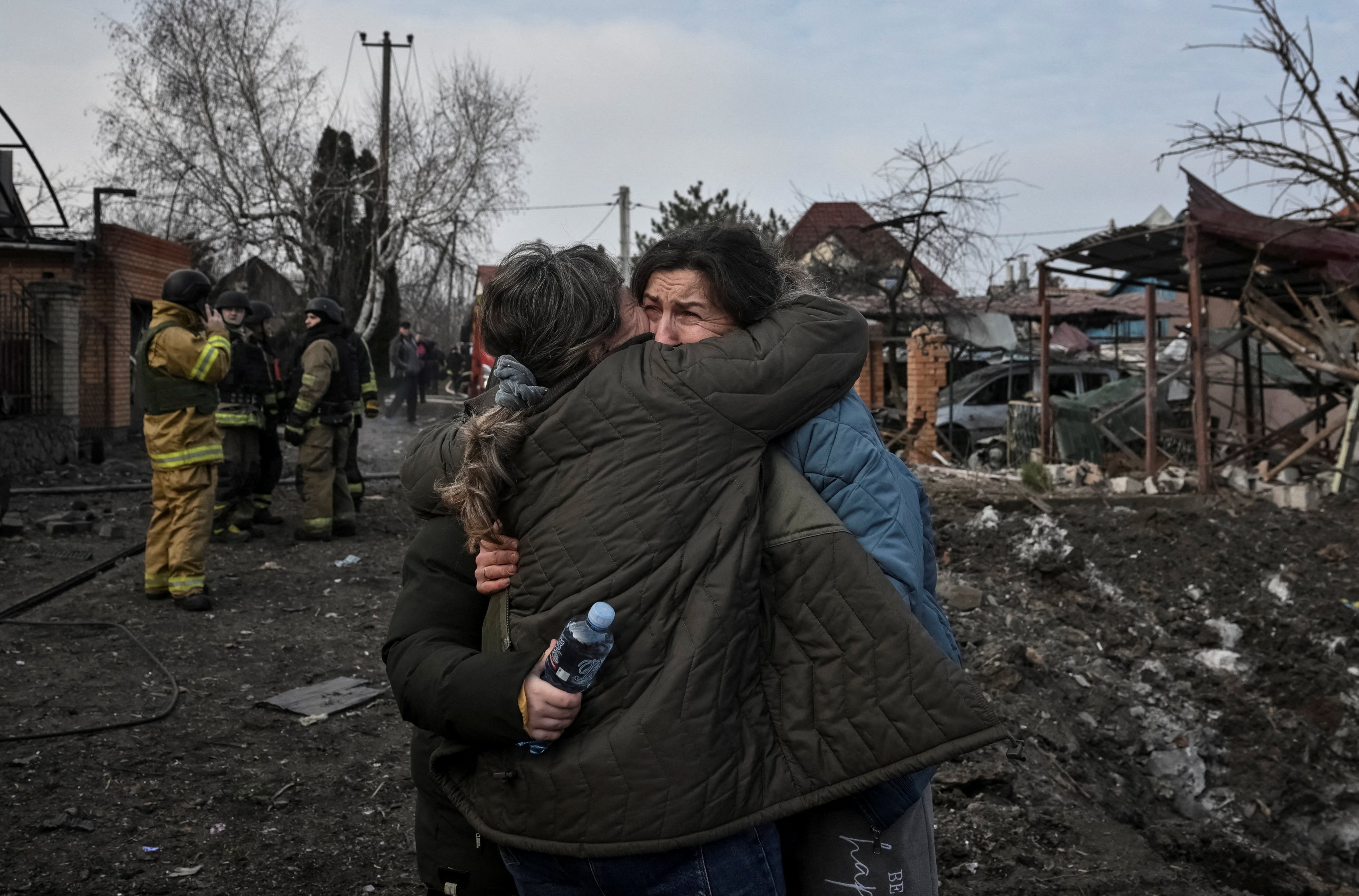 Residents react at the site of a Russian air strike in Zaporizhzhia, Ukraine, on Friday. Photo: Reuters