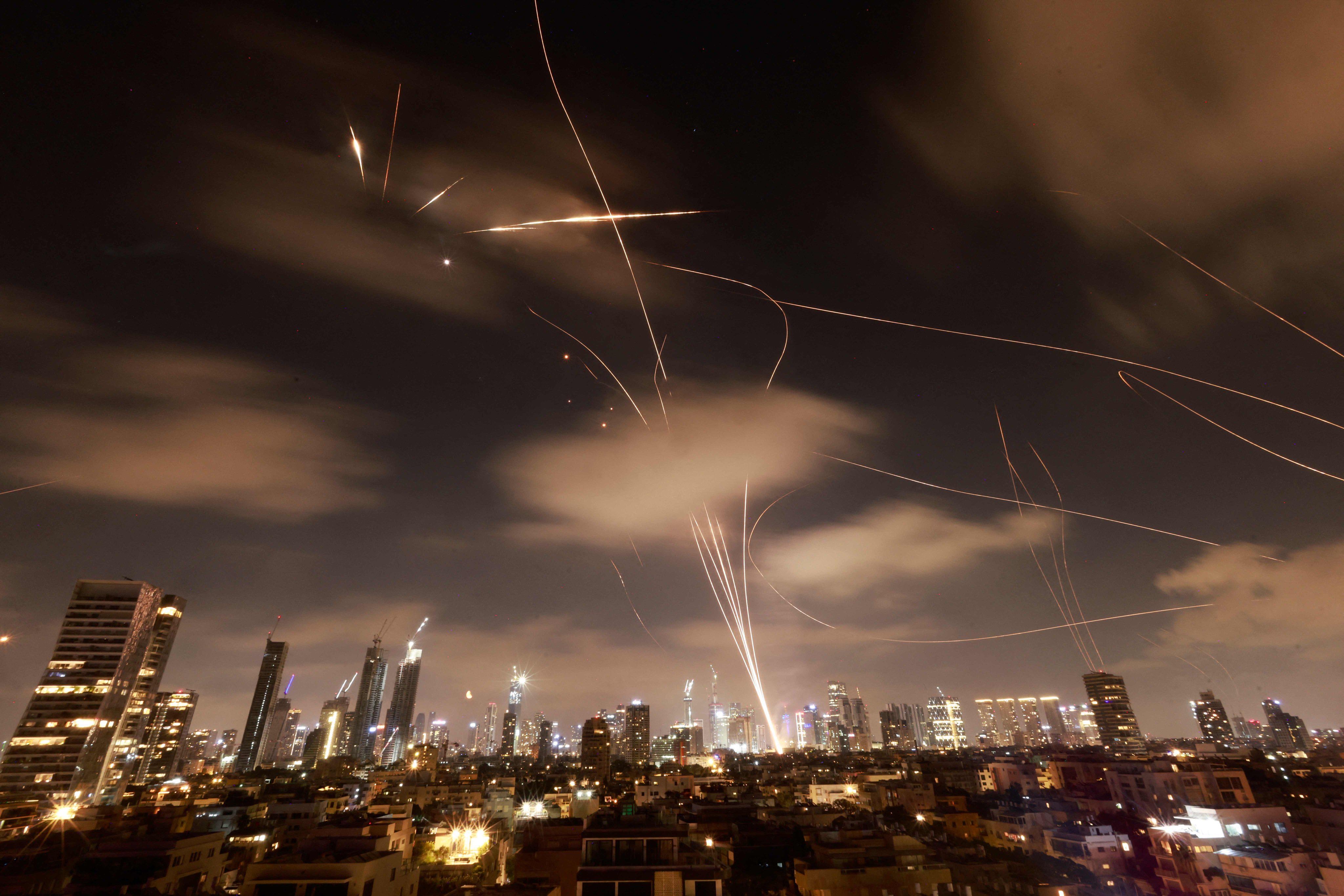 Israeli air defence systems intercept Iranian missiles over the Israeli city of Tel Aviv early on June 18. Photo: AFP